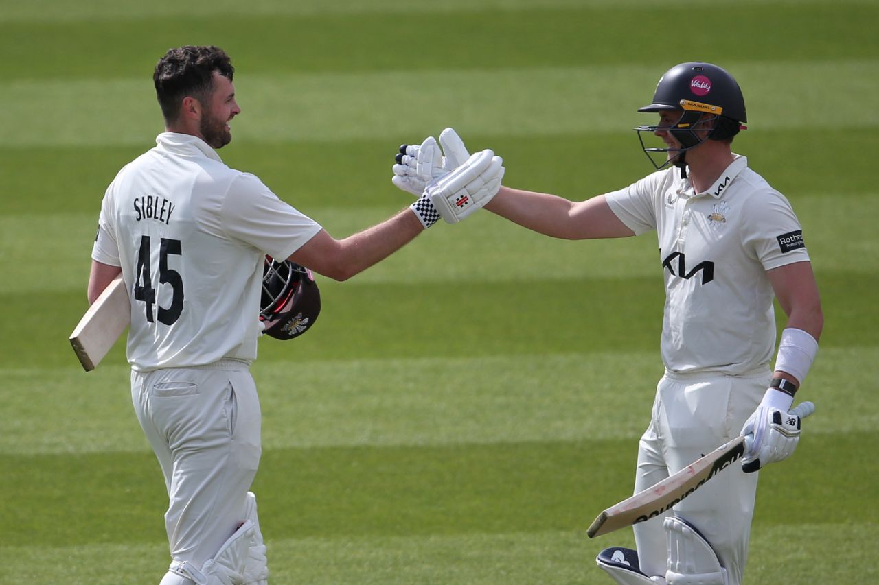 Dom Sibley gets congratulations from Jamie Smith after his second hundred of the match, Surrey vs Hampshire, County Championship, Kia Oval, April 13, 2025