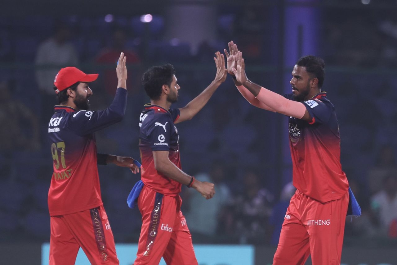 Rajat Patidar and Bhuvneshwar Kumar high-five Yash Dayal after a wicket, Delhi Capitals vs Royal Challengers Bengaluru, IPL 2025, Delhi, April 27, 2025