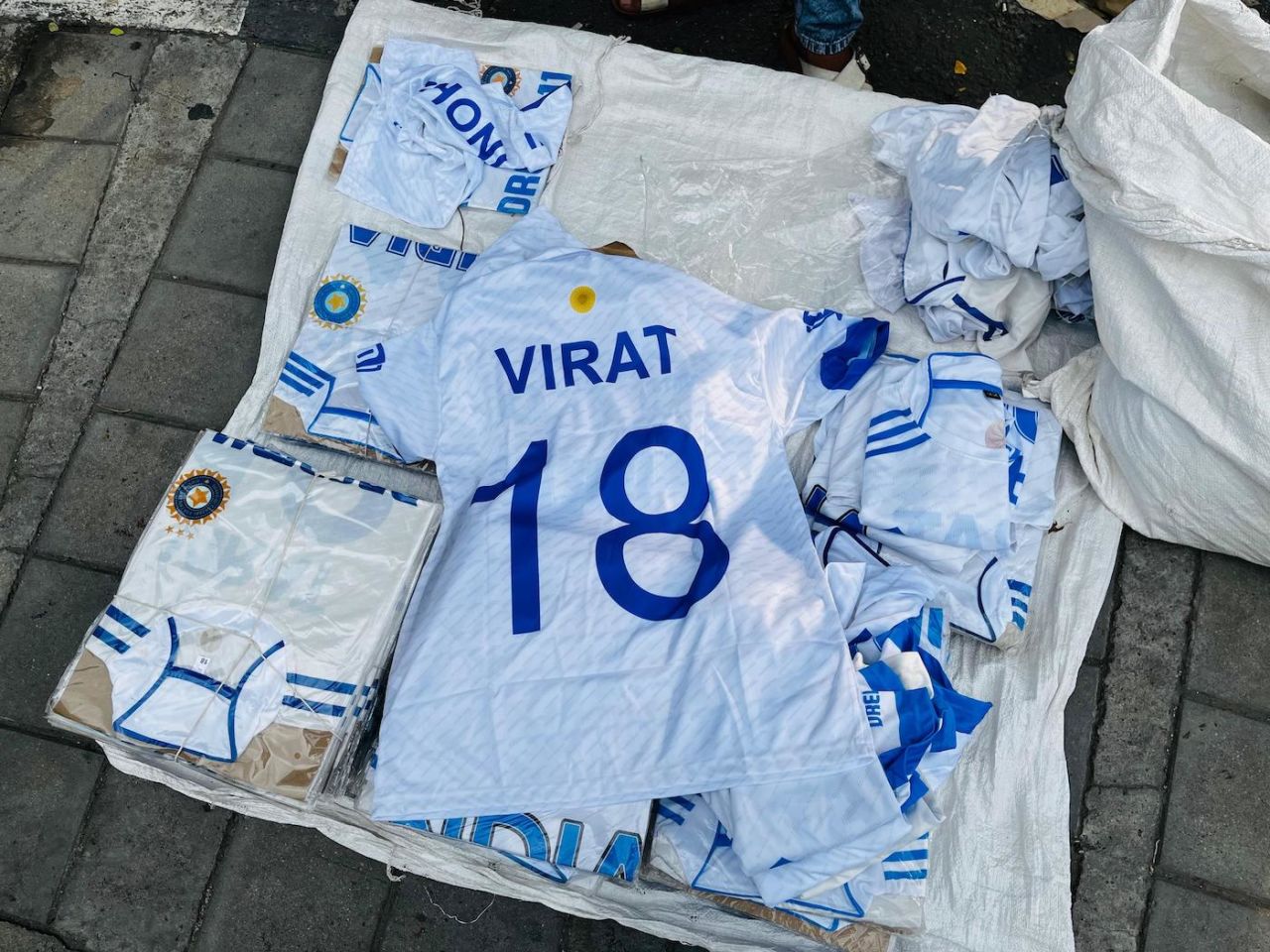 Hawkers set up shop with Virat Kohli tribute jerseys outside the Chinnaswamy Stadium following his Test retirement, Royal Challengers Bengaluru vs Kolkata Knight Riders, IPL 2025, May 16, 2025
