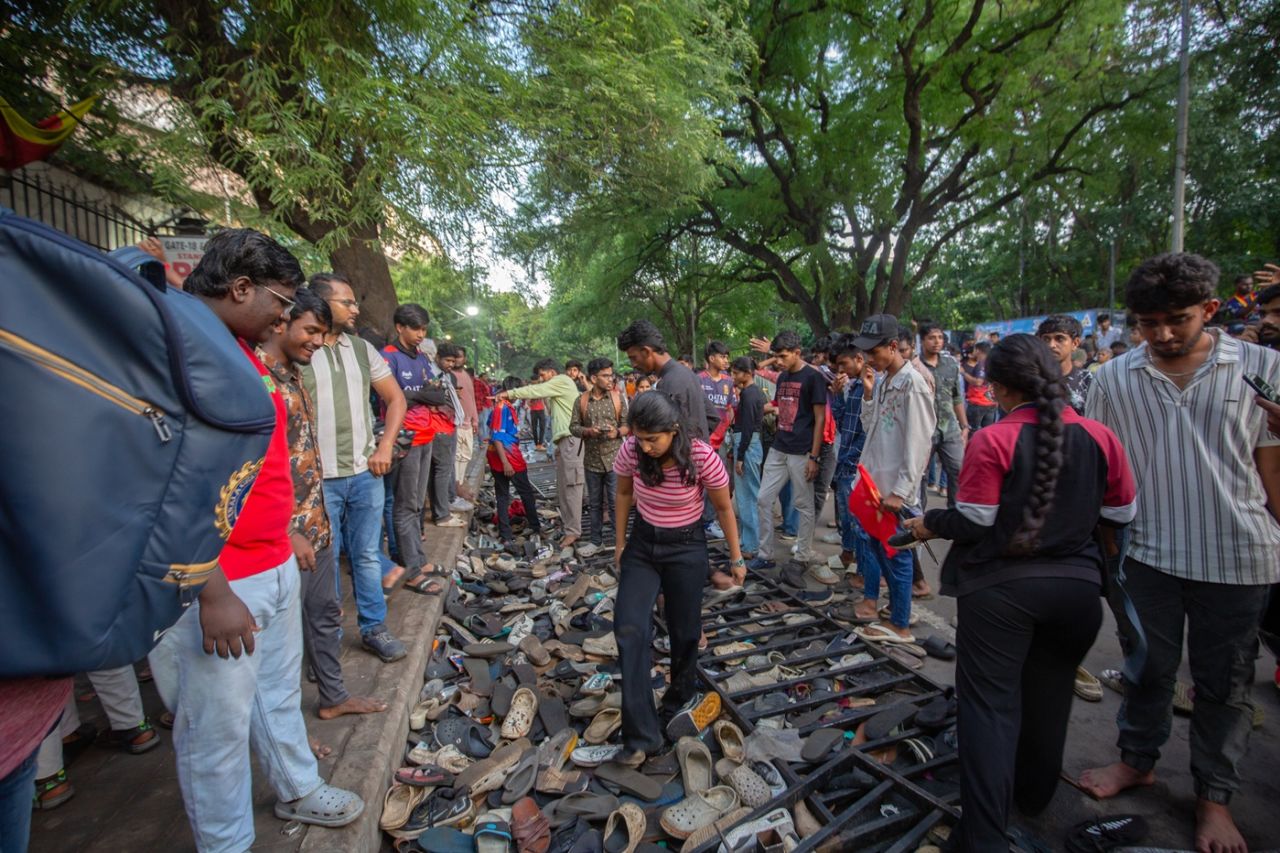 Fans in Bengaluru look for shoes and other belongings, Bengaluru, June 4, 2025