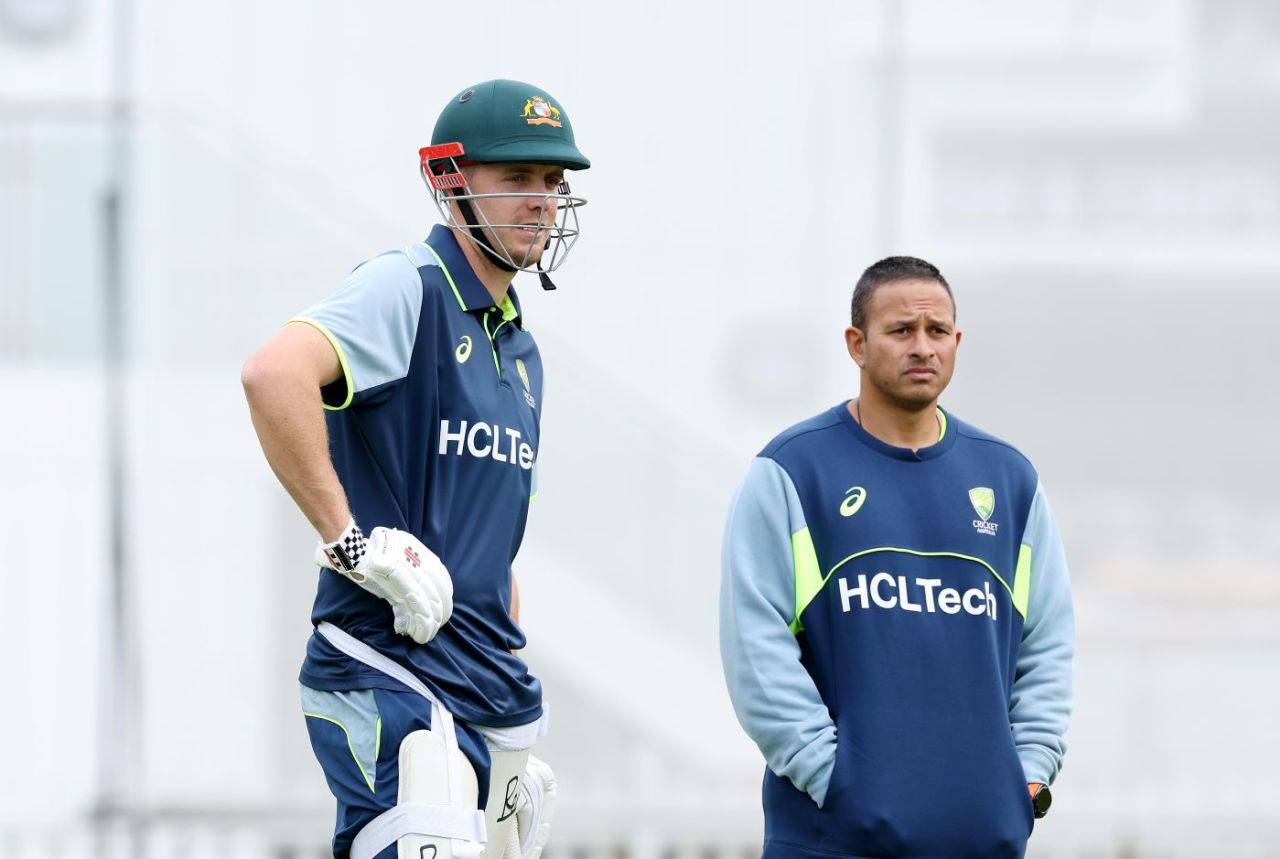Cameron Green waits to bat at training alongside Usman Khawaja