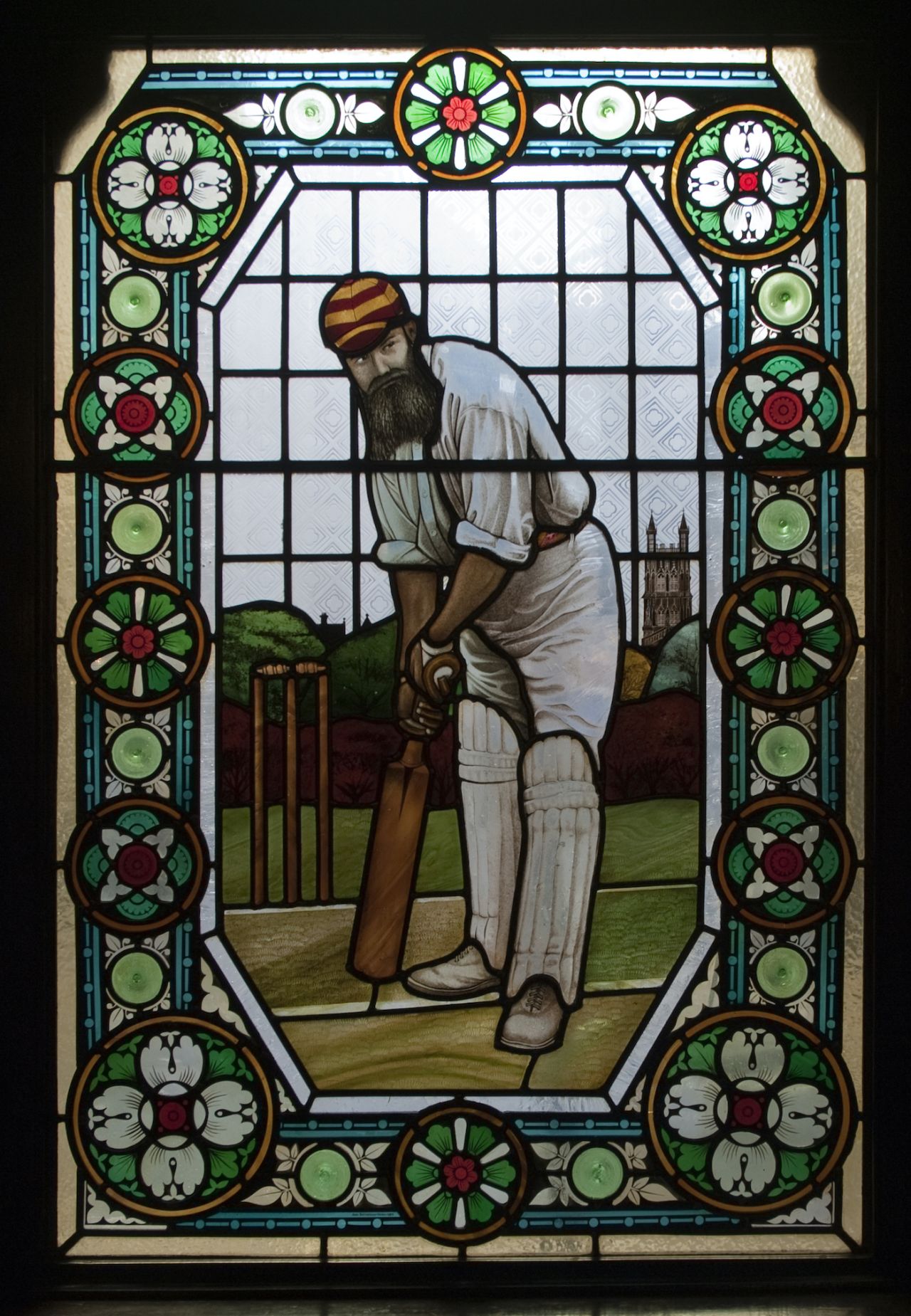 A stained-glass window depicting cricketer WG Grace in the Champion public house in Wells Street, Marylebone,