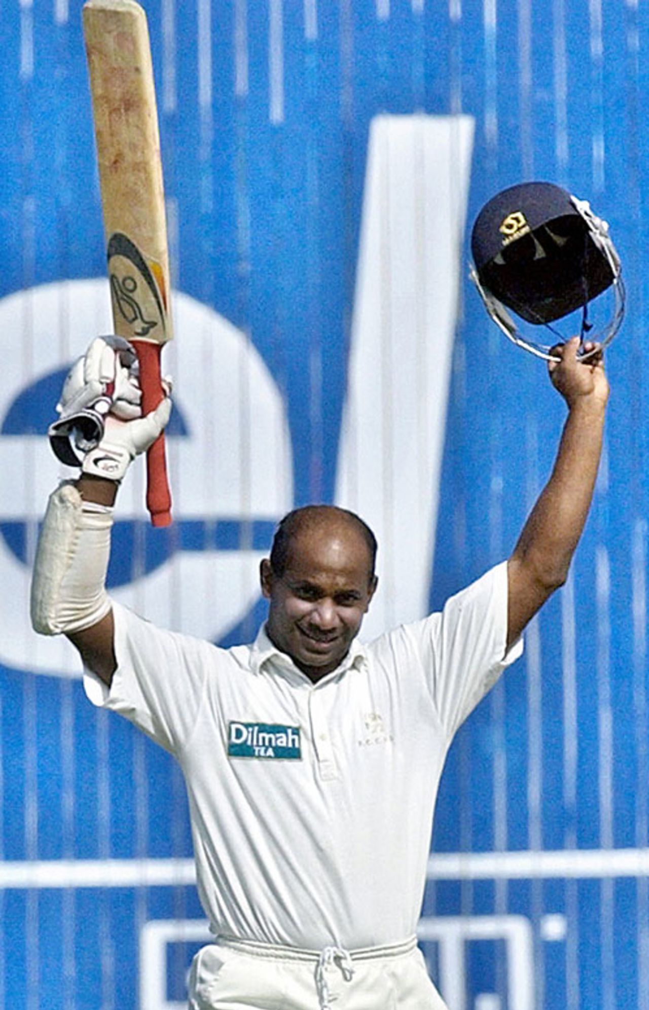 Sanath Jayasuriya raises his bat after reaching a hundred, Pakistan v Sri Lanka, 2nd Test, Karachi, 4th day, October 31, 2004