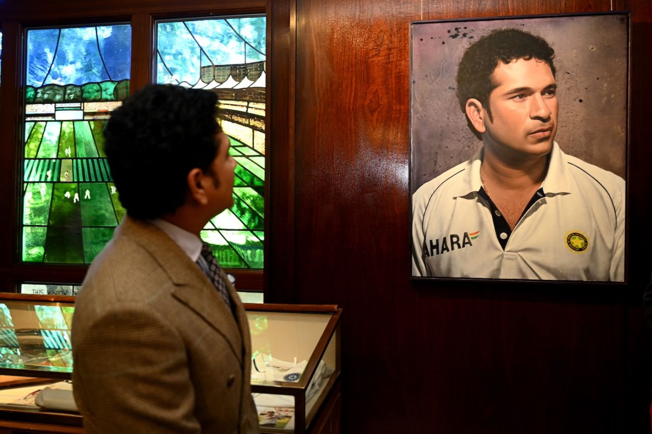 Sachin Tendulkar poses with his portrait at the Lord's museum, London, July 10, 2025