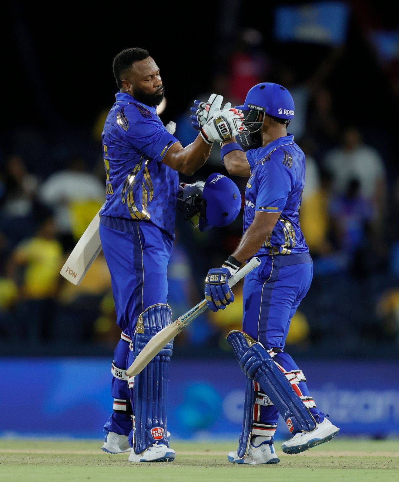 Kieron Pollard and Nicholas Pooran celebrate after completing the job, MI New York vs Texas Super Kings, MLC 2025 Qualifier 2, Dallas, July 11, 2025