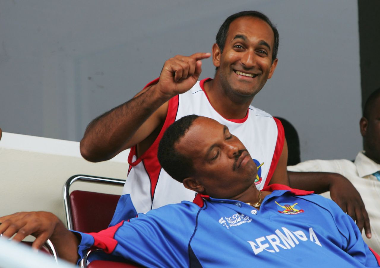 Saleem Mukuddem is deeply amused at team-mate Clay Smith falling asleep waiting for the match to start , Trinidad, March 25, 2007