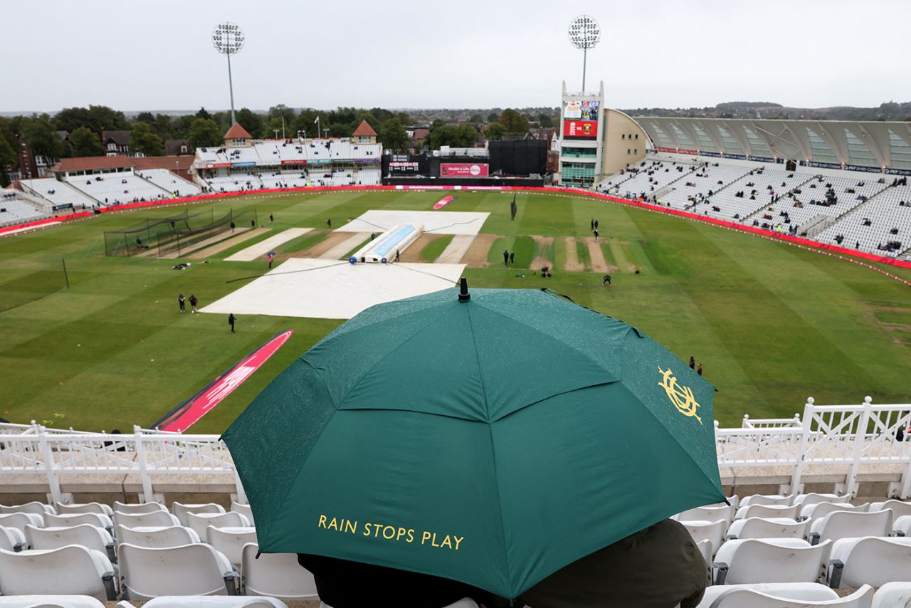 Fans huddle under an umbrella at Trent Bridge, England vs South Africa, 3rd Men's T20I, Trent Bridge, Nottingham, September 14, 2025