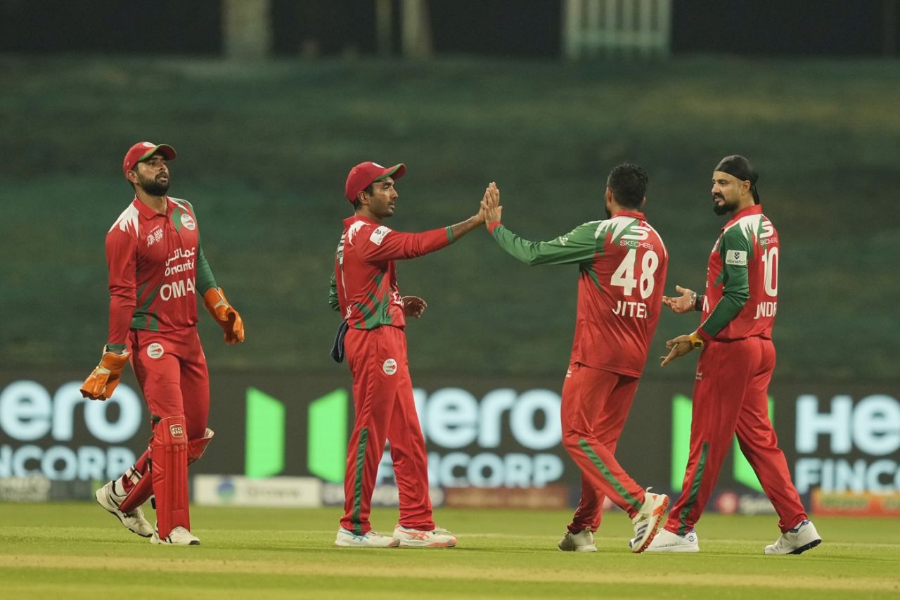 The Oman fielders celebrate the fall of a wicket, India vs Oman, Asia Cup, Dubai, September 19, 2025
