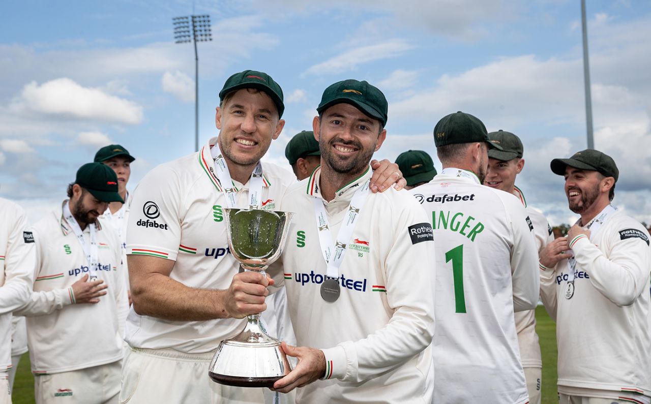 Logan van Beek and Leicestershire captain Ian Holland pose with the trophy, Northamptonshire vs Leicestershire, County Championship, Wantage Road, September 27, 2025