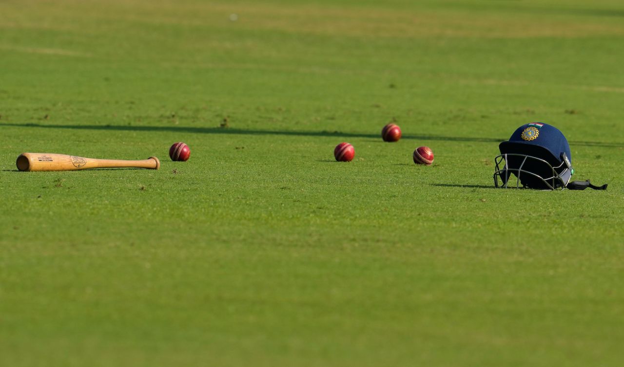 An India helmet, a few red balls, and... a baseball bat lie on the Delhi field, India vs West Indies, 2nd Test, Delhi, 3rd Day, October 12, 2025