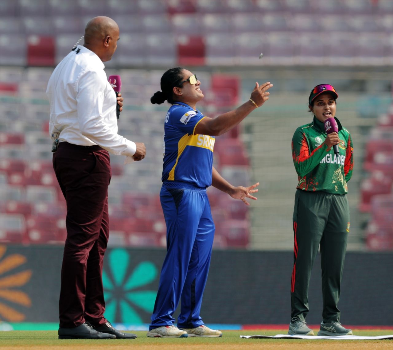Sri Lanka captain Chamari Athapaththu tosses and Bangladesh's Nigar Sultana calls as commentator Ian Bishop looks on, Bangladesh vs Sri Lanka, Women's World Cup 2025, Navi Mumbai, October 20, 2025