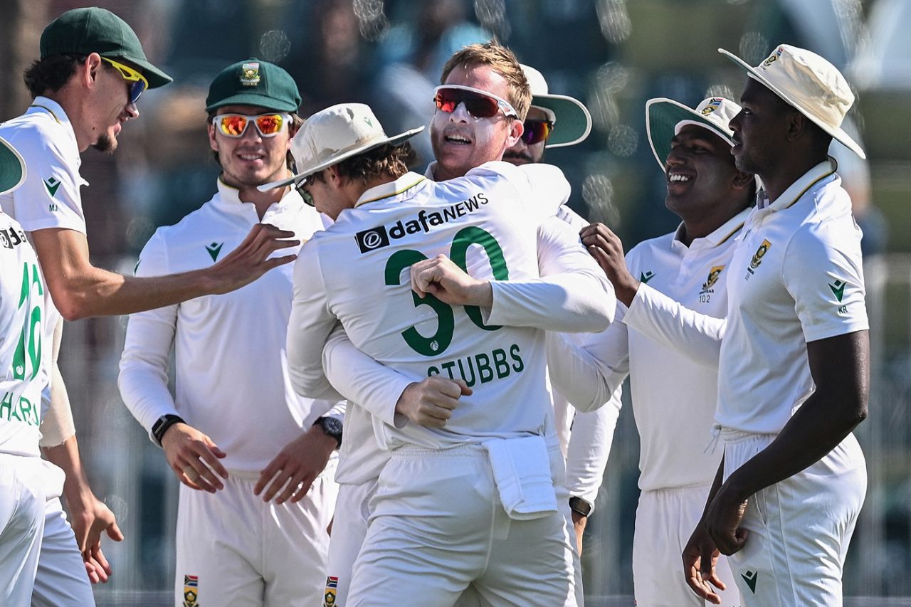 Simon Harmer is swamped by his team-mates after completing his maiden Test five-for, Pakistan vs South Africa, 2nd Test, Rawalpindi, 4th day, October 23, 2025