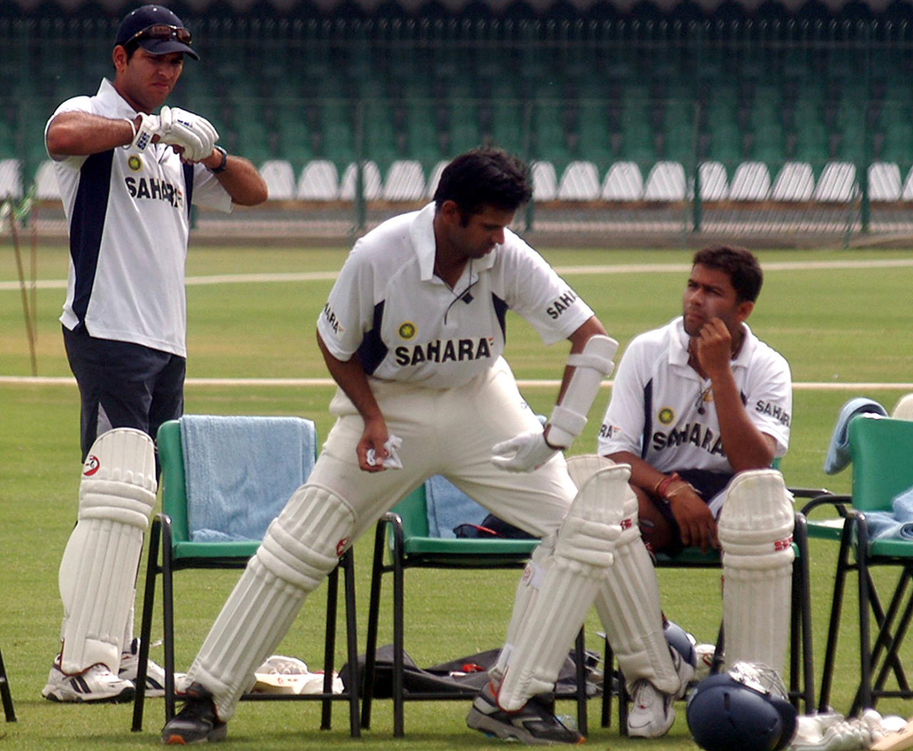 Rahul Dravid shadow-bats as Yuvraj Singh (left) and Aakash Chopra look on, Lahore, April 10, 2004