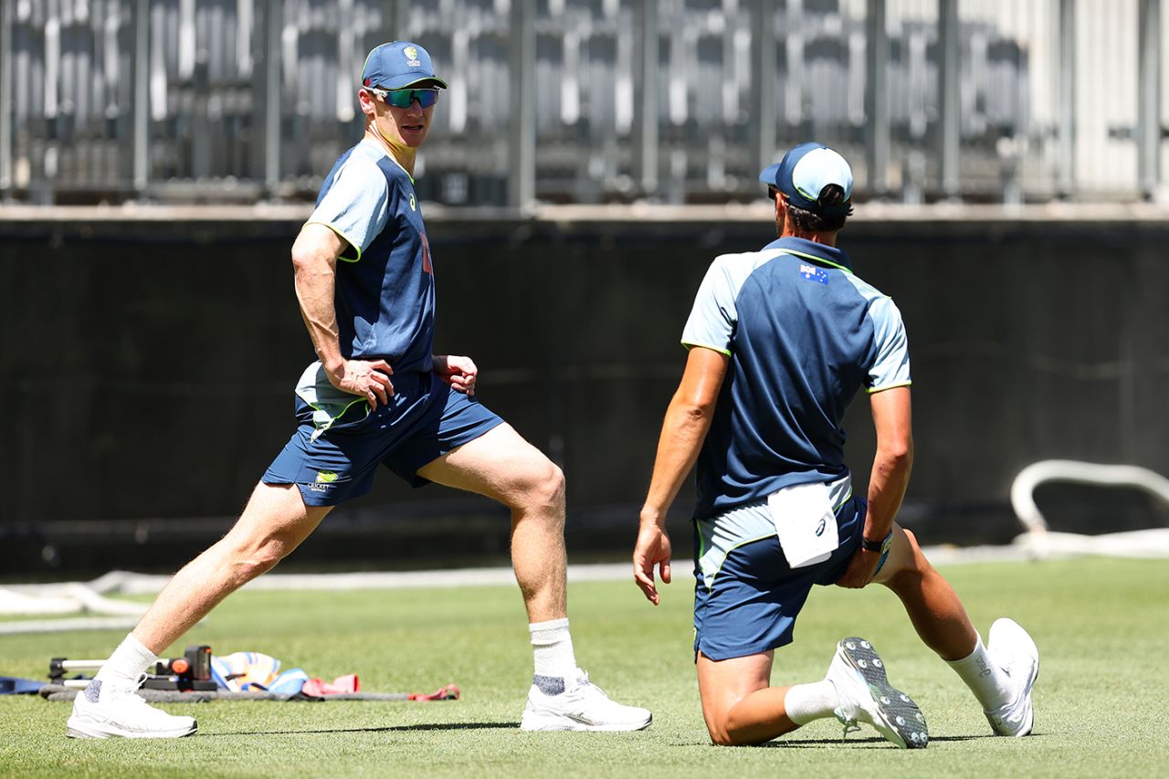 Brendan Doggett and Mitchell Starc warm up at Australia training, Optus Stadium, November 17, 2025