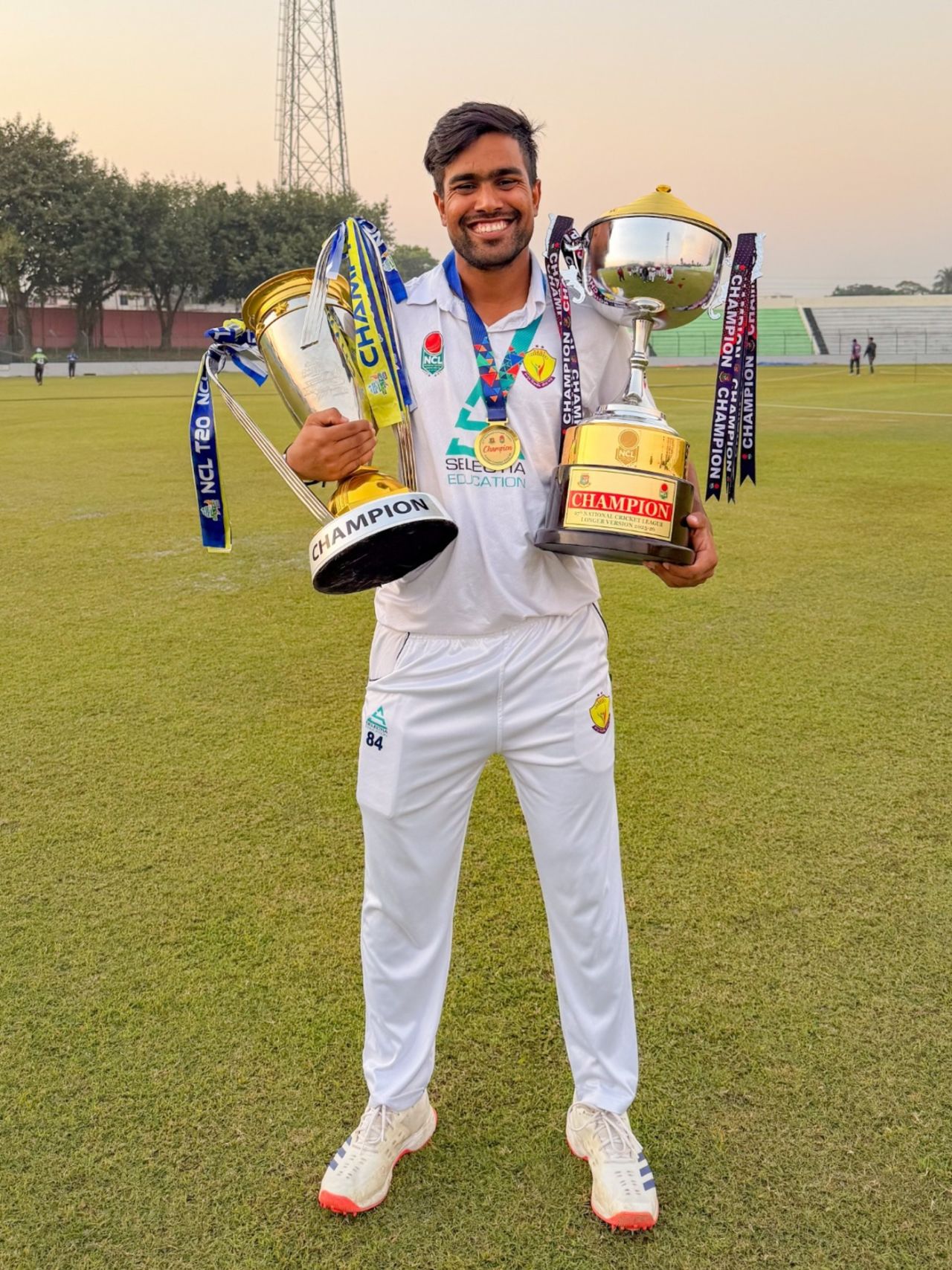 Akbar Ali with both NCL T20 and first-class trophies, Bogra, December 9, 2025