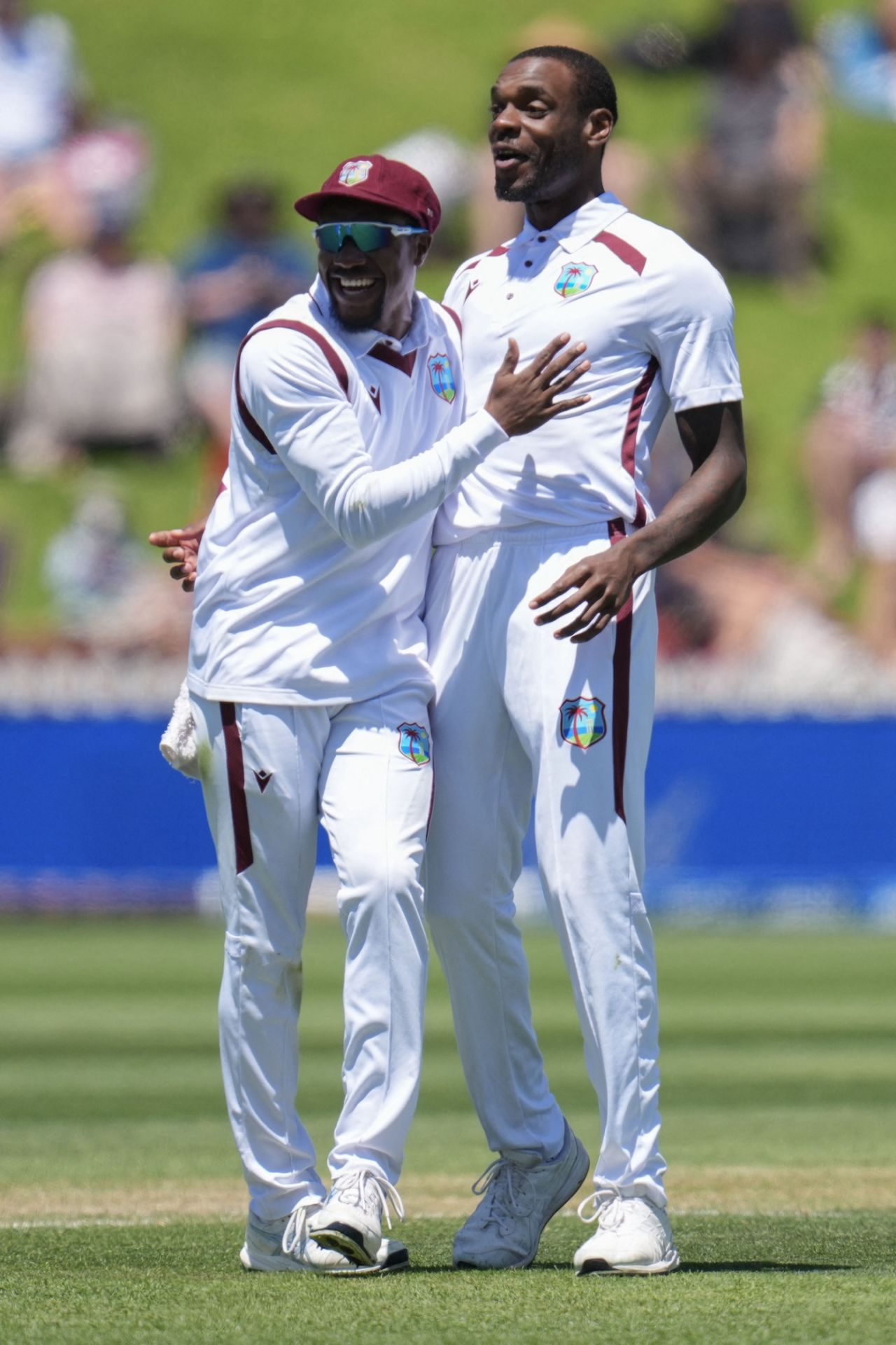 Justin Greaves and Kavem Hodge celebrate after the fall of Devon Conway, New Zealand vs West Indies, 2nd Test, Wellington, 2nd day, December 11, 2025
