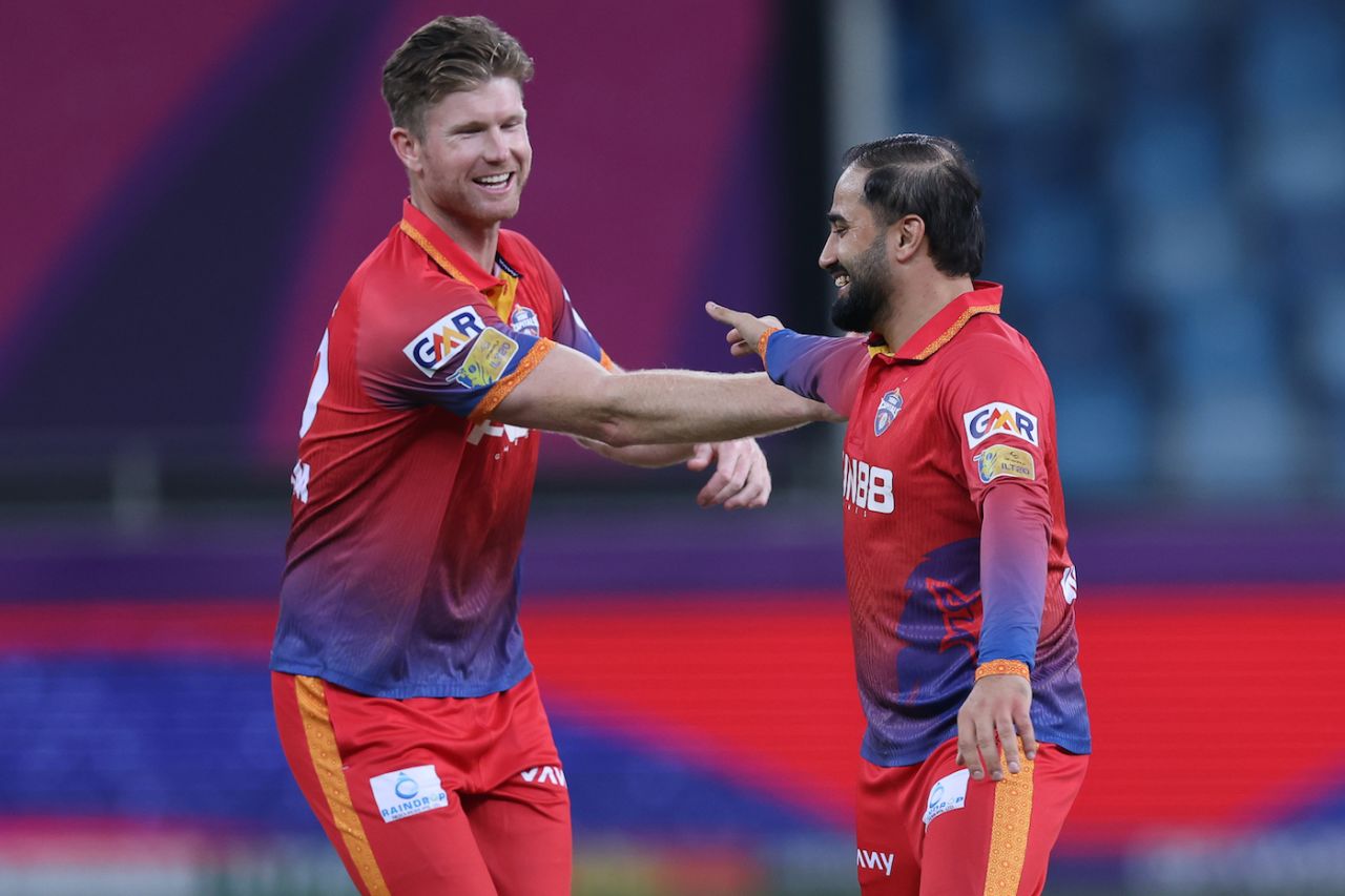 Waqar Salamkheil, who finished with 2 for 29, celebrates with James Neesham, Dubai Capitals vs Sharjah Warriorz, ILT20 2025-26, Dubai, December 24, 2025