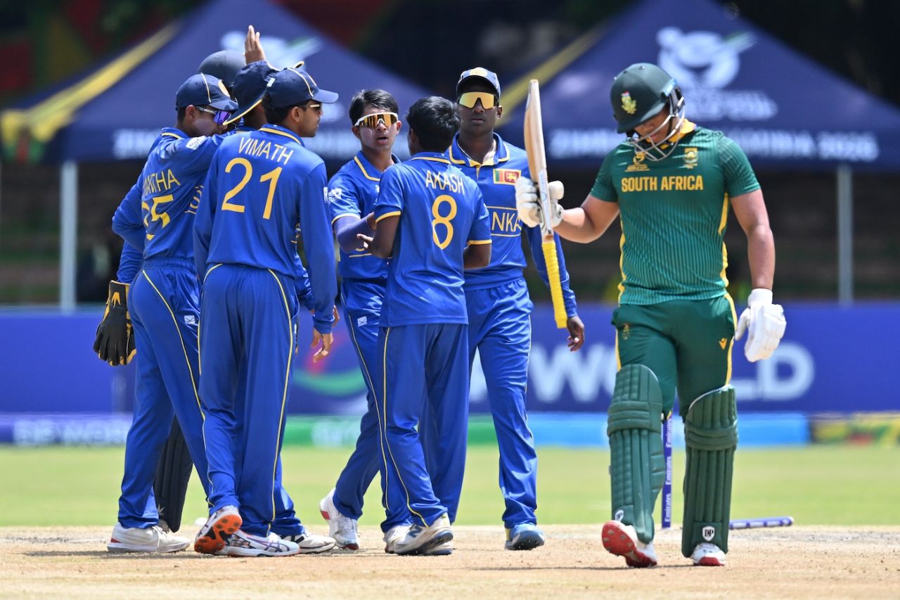 Akash Vigneswaran celebrates a wicket with his team-mates