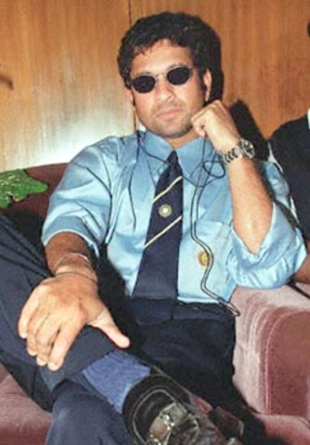 Indian cricket star Sachin Tendulkar listens to music at the Zia International Airport, 07 November 2000, in Dhaka after the arrival of his team in Bangladesh. Bangladesh will play its maiden test match aganist India from 10 to 14 November in Dhaka.