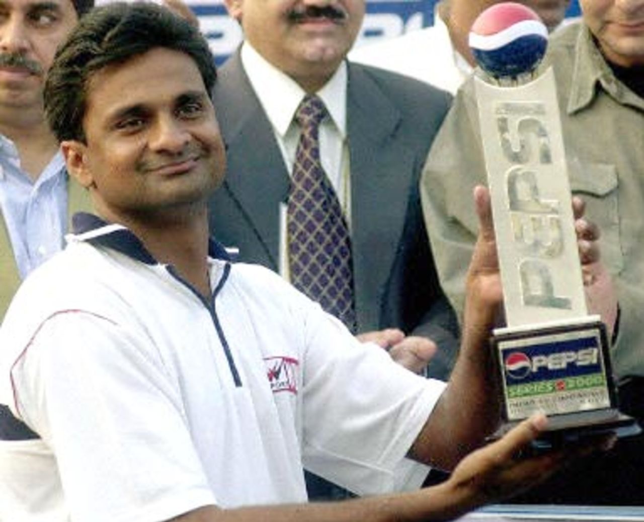 Indian pace bowler Javagal Srinath holds up his man-of-the-match trophy at the end of the first test match between India and Zimbabawe 22 November 2000 at the Ferozshah Kotla Ground in New Delhi. Srinath set up the home team's win with a five for 60 in the second innings for a match haul of nine wickets on the wearing but placid Kotla ground.