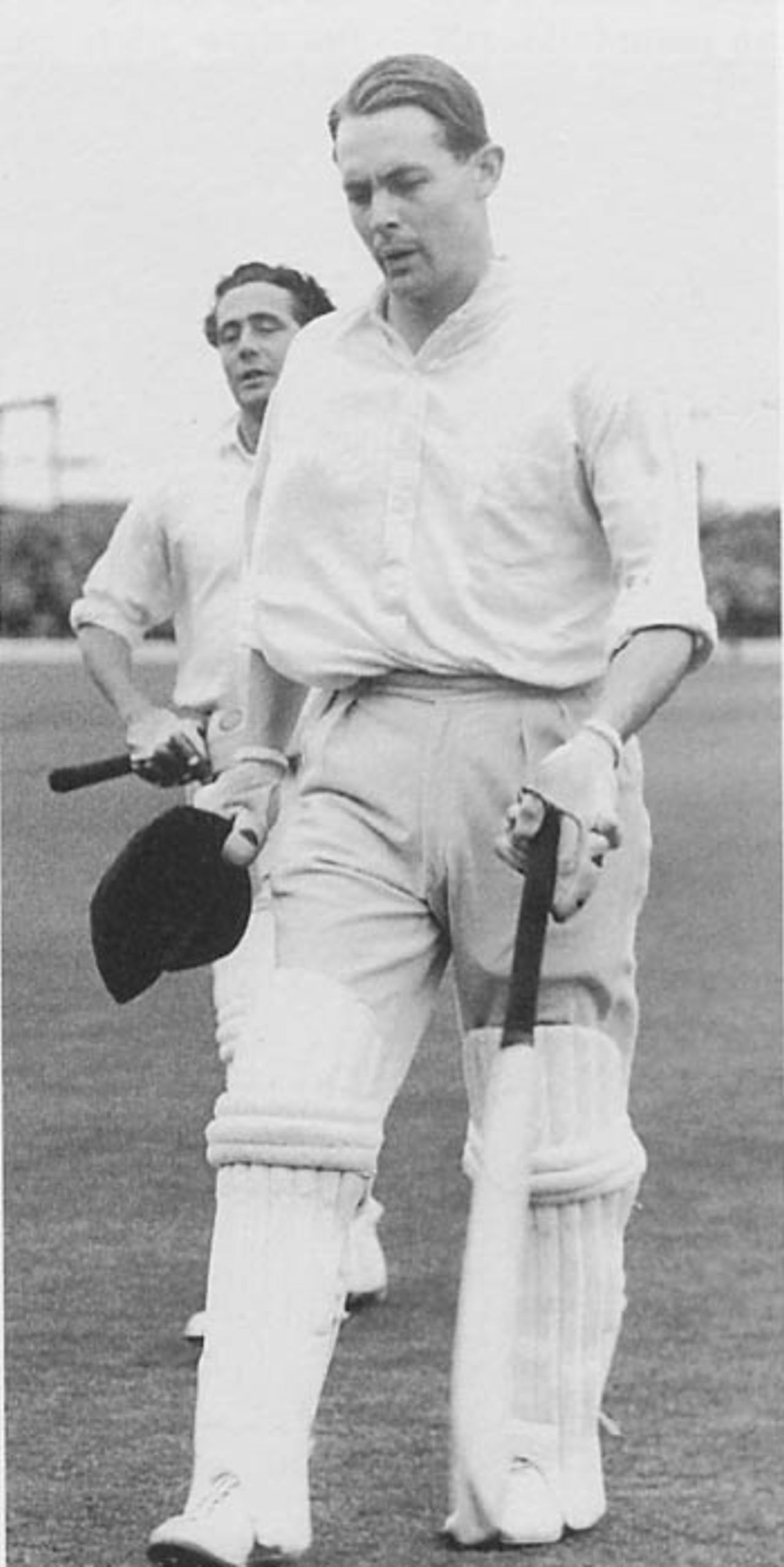 David Sheppard returns to the pavilion at the end of the first day of the 1956 Ashes Test at Old Trafford. Sheppard, who was 59 not out, was playing in his first Test in two years, one of several bold selection gambles that summer. He scored 113.