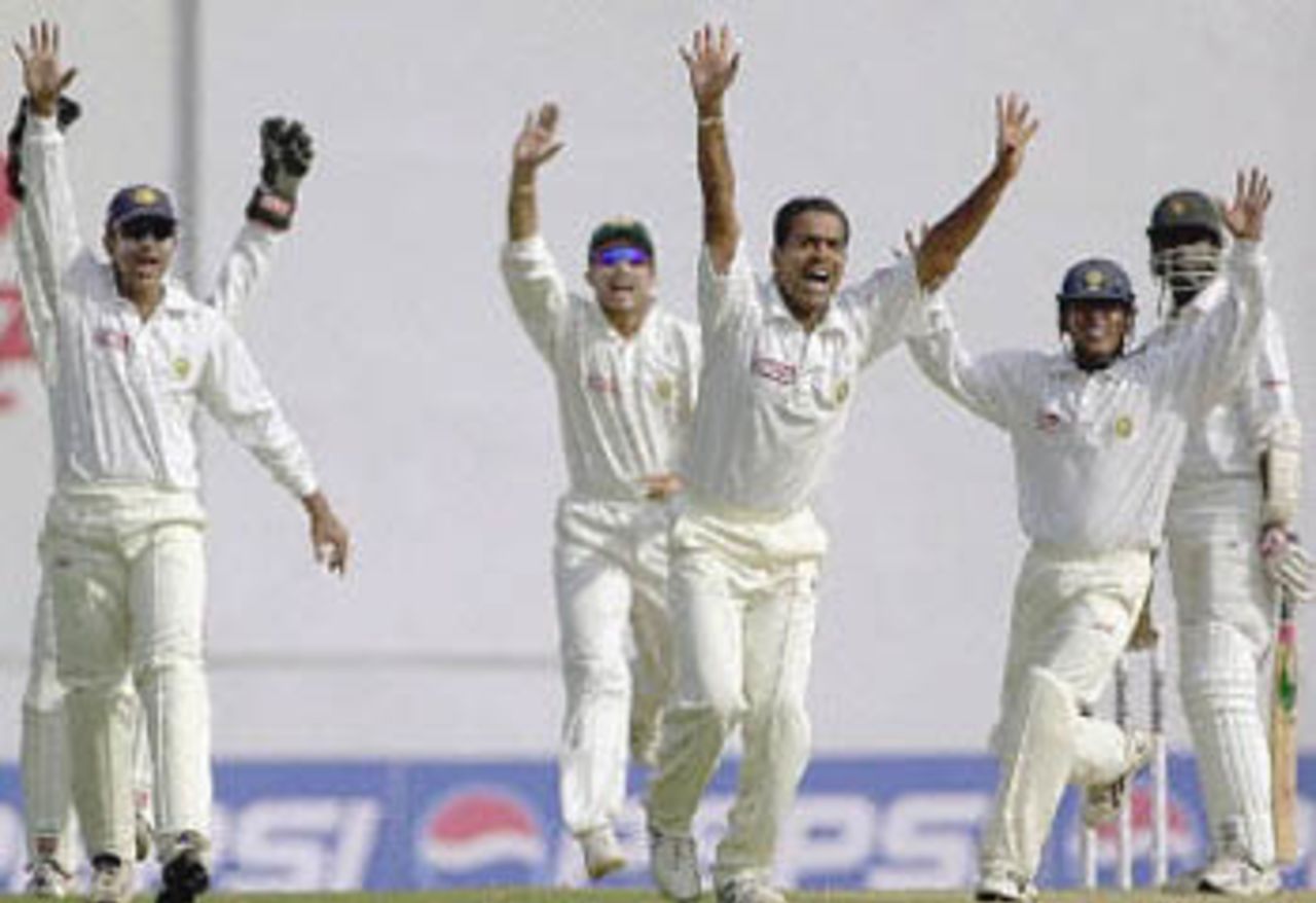 Bowler Joshi and other close-in fielders appeal unsuccessfully for an LBW against Nkala, Zimbabwe in India, 2000/01, 2nd Test, India v Zimbabwe, Vidarbha C.A. Ground, Nagpur, 25-29 November 2000 (Day 4).
