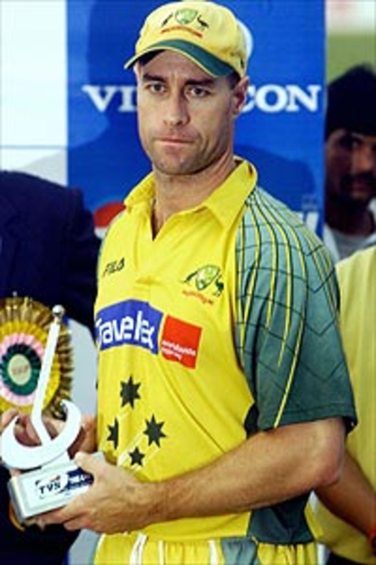 Australian cricketer Michael Bevan poses with the Man of the Match trophy during the prize distribution ceremony of the TVS tri-series One Day International match between New Zealand and Australia, at the Nehru Stadium in Guwahati, 09 November 2003.