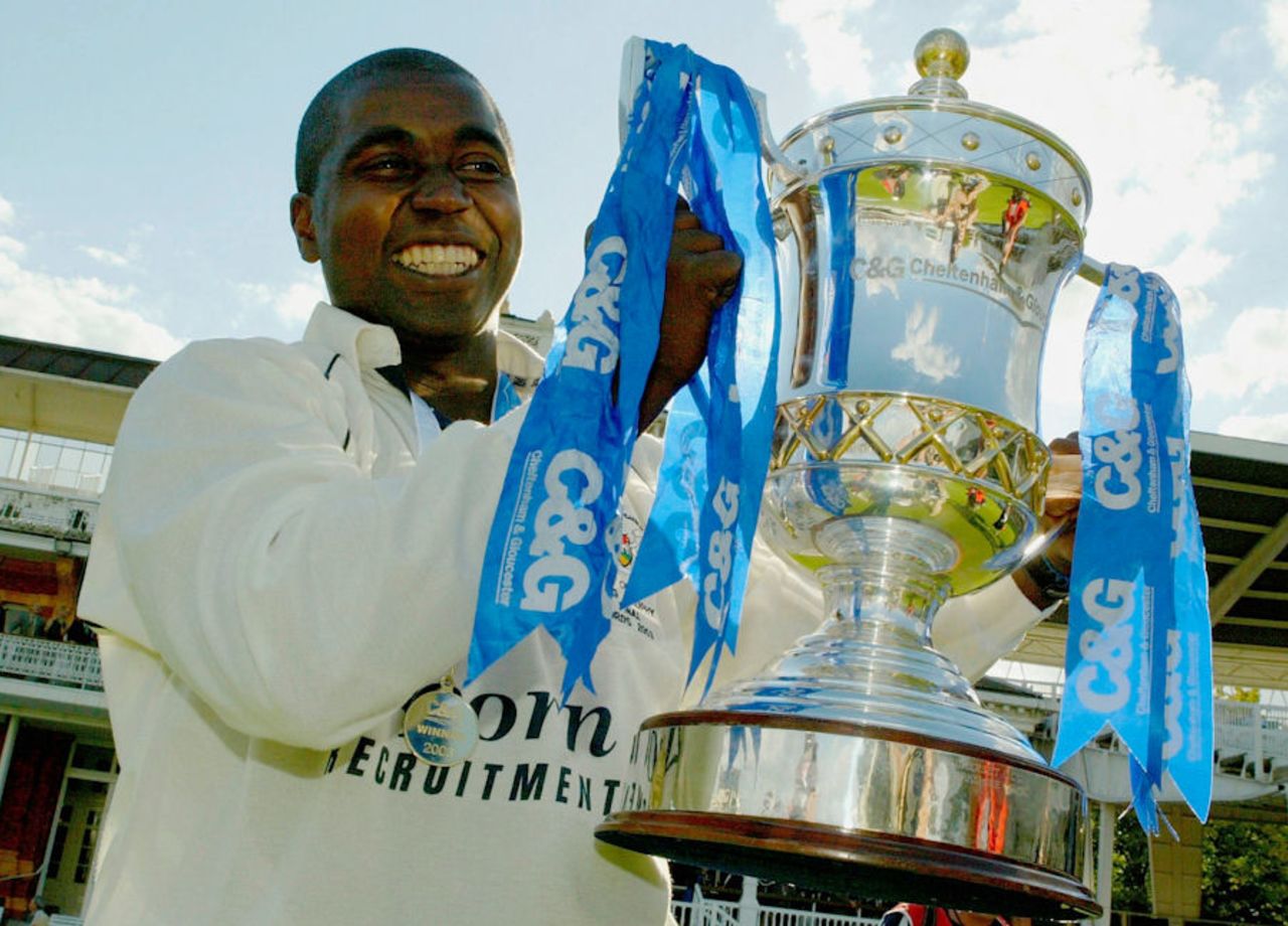 Mark Alleyne lifts the C&G Trophy