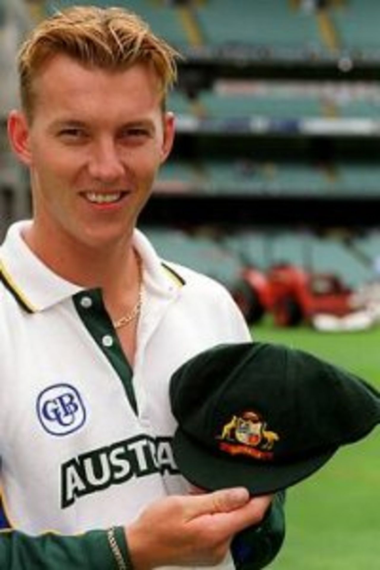 26 Dec 1999: Test debutant Brett Lee of Australia is presented with his baggy green cap before the Boxing Day Cricket Test match between Australia and India at the Melbourne Cricket Ground, Melbourne, Australia. Bad light stopped play with Australia on 3 for 138.