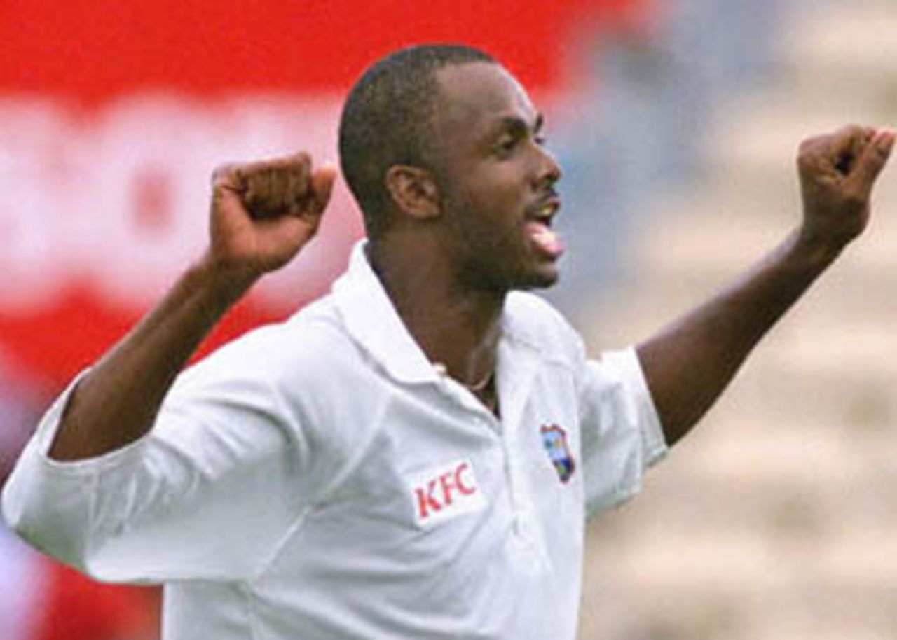 West Indies bowler Courtney Walsh celebrates after taking the wicket of Australian batsman Ricky Ponting on day three of the third Test match at the Adelaide Oval, 17 December 2000. Ponting was out for 92 runs with Australia currently on six for 379 chasing the West Indies first innings score of 391.