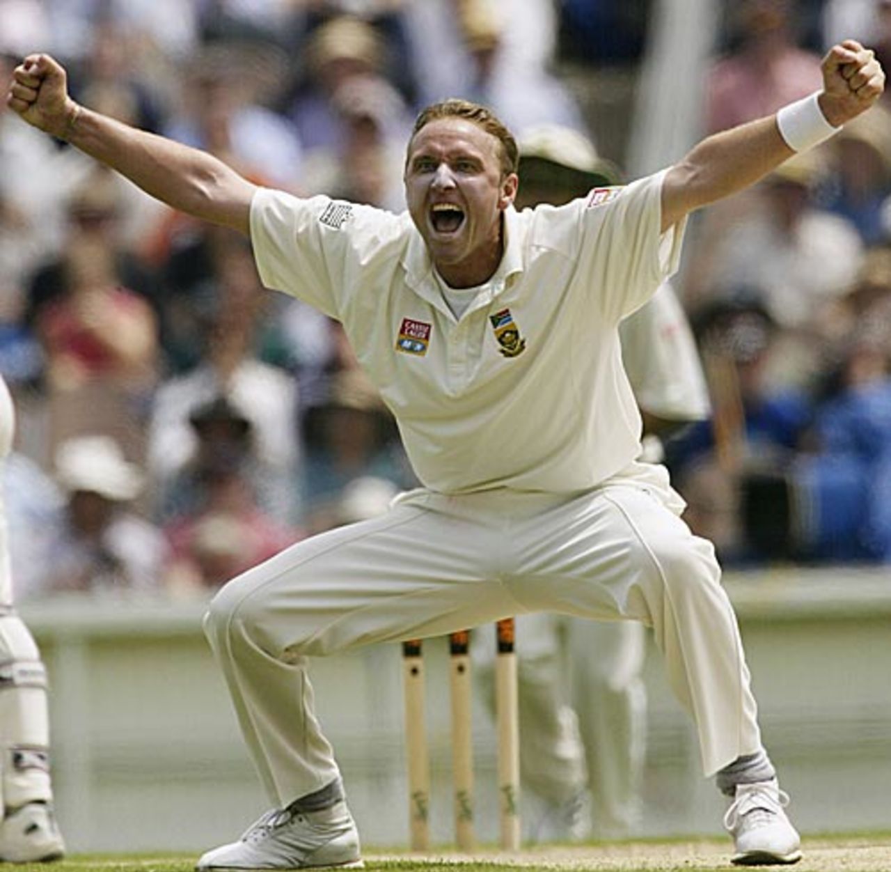 28 Dec 2001: Allan Donald of South Africa celebrates after taking the wicket of Justin Langer of Australia, caught by Lance Klusener for 85, during day three of the second Test between Australia and South Africa, played at the Melbourne Cricket Ground, Melbourne, Australia.