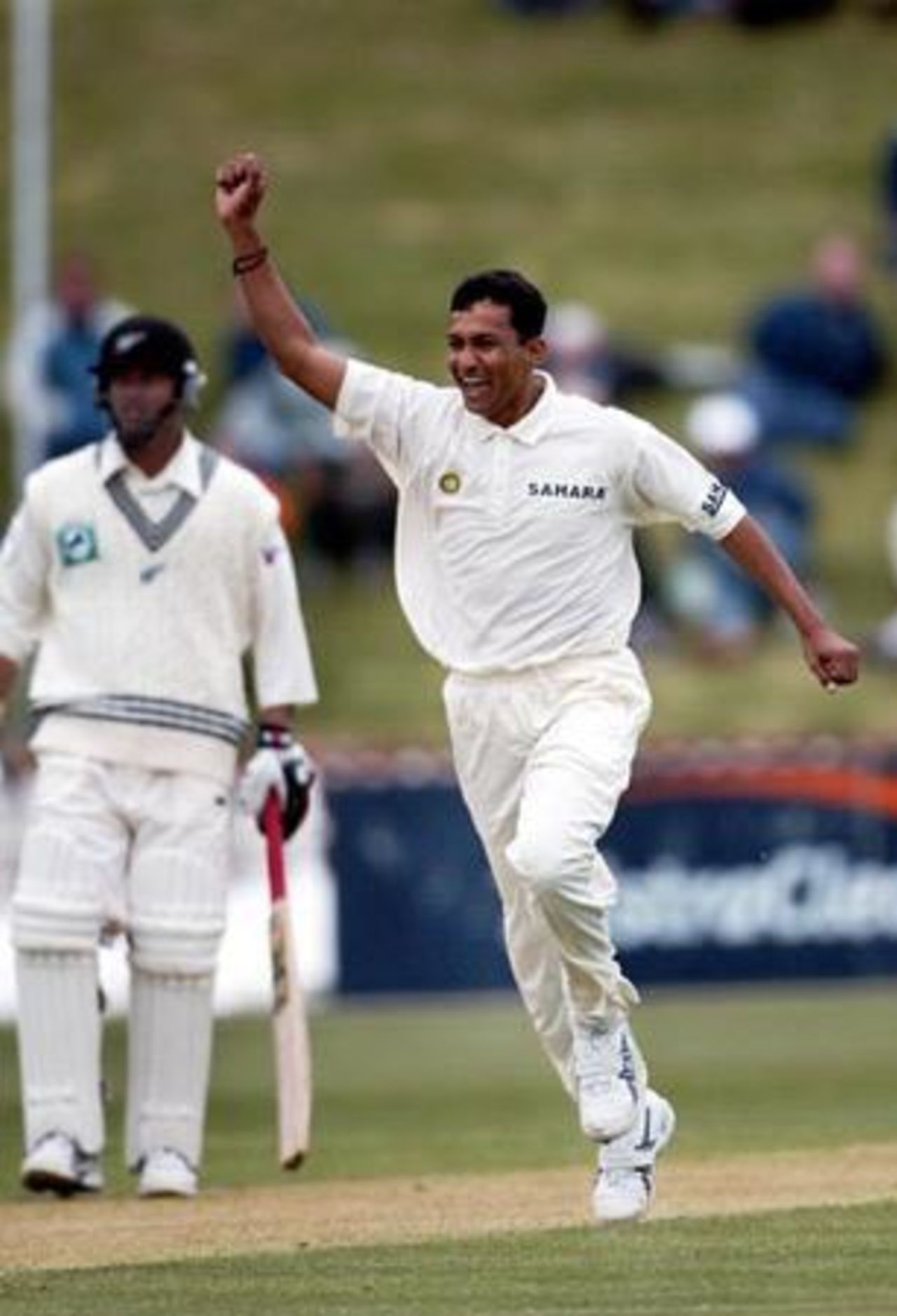 Indian bowler Sanjay Bangar celebrates the dismissal of New Zealand batsman Lou Vincent, caught by wicket-keeper Parthiv Patel for 12. Non-striking batsman Mark Richardson looks on. 1st Test: New Zealand v India at Basin Reserve, Wellington, 12-16 December 2002 (12 December 2002).