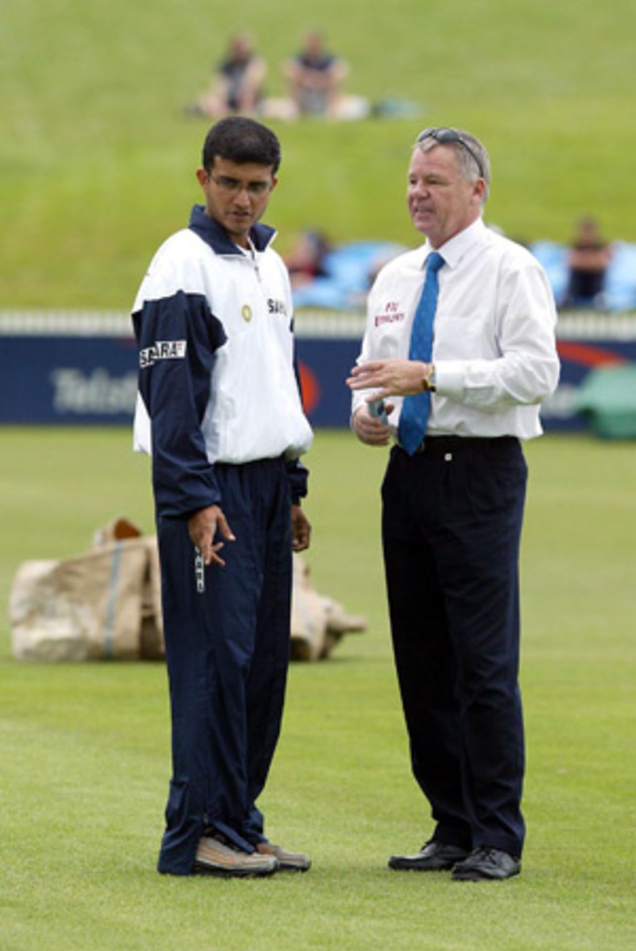Indian captain Sourav Ganguly (left) talks to match referee Mike Procter about the condition of the ground as the start of play is delayed. Play was eventually abandoned on day one. 2nd Test: New Zealand v India at Westpac Park, Hamilton, 19-23 December 2002 (19 December 2002).