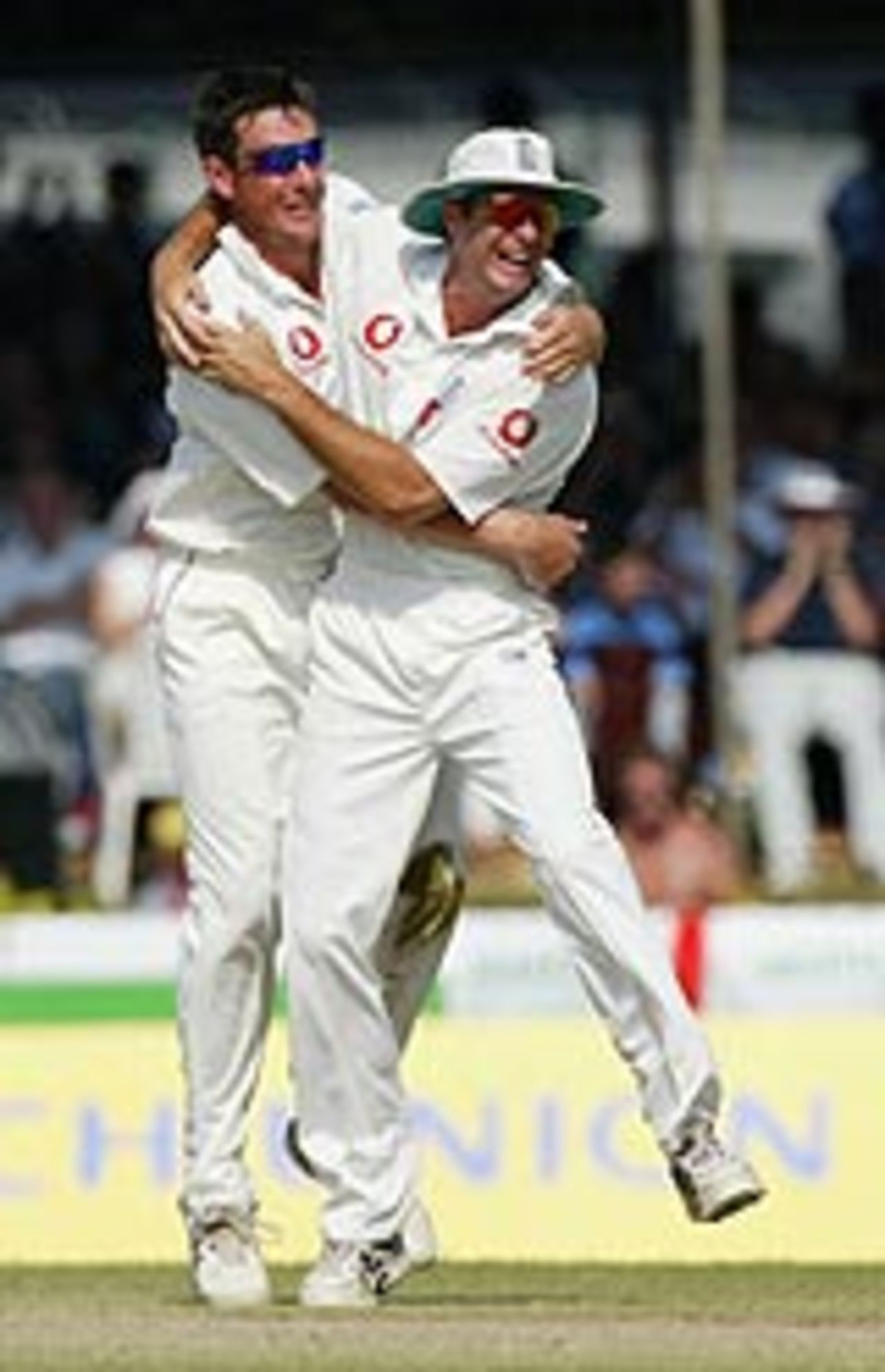 Ashley Giles and Michael Vaughan celebrate the fall of a wicket