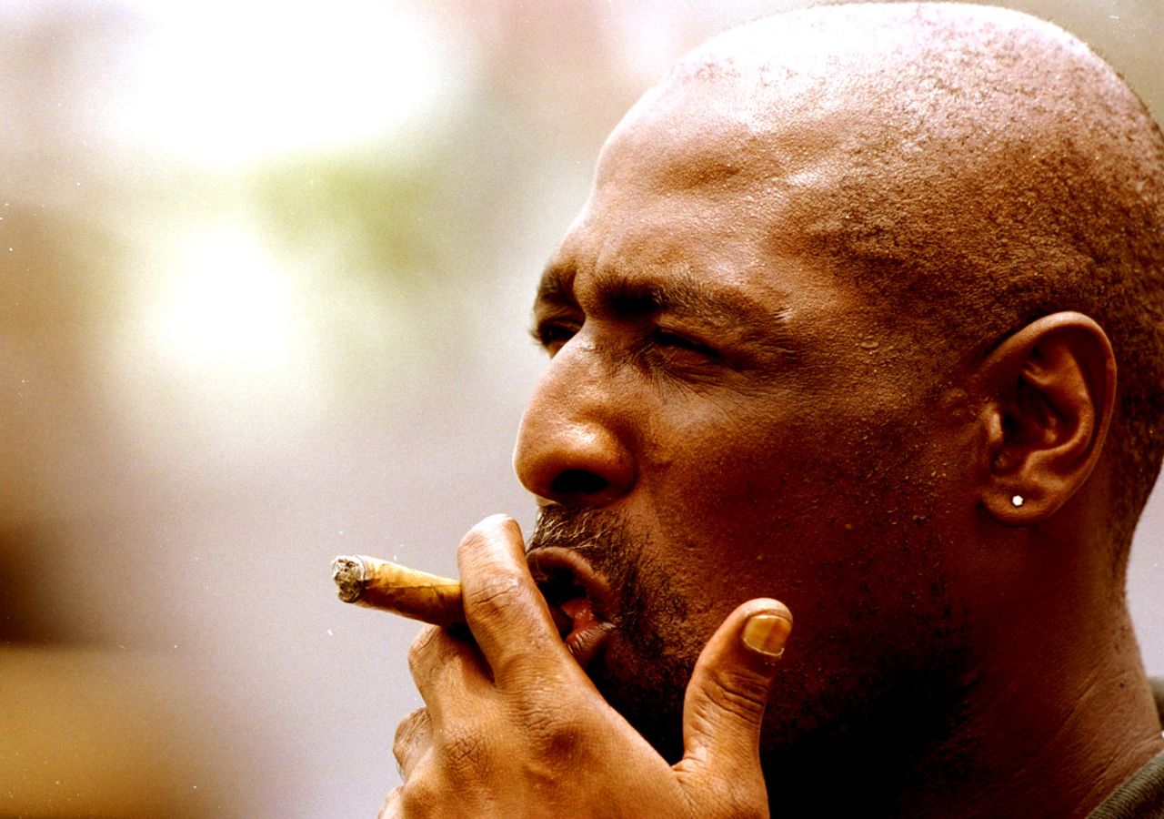 Viv Richards smokes a cigar