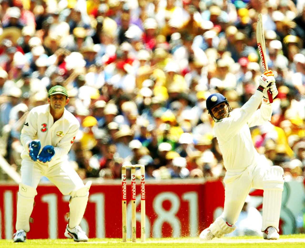 Virender Sehwag launches into a big drive, Australia v India, 3rd Test, Melbourne, 1st day, December 26, 2003