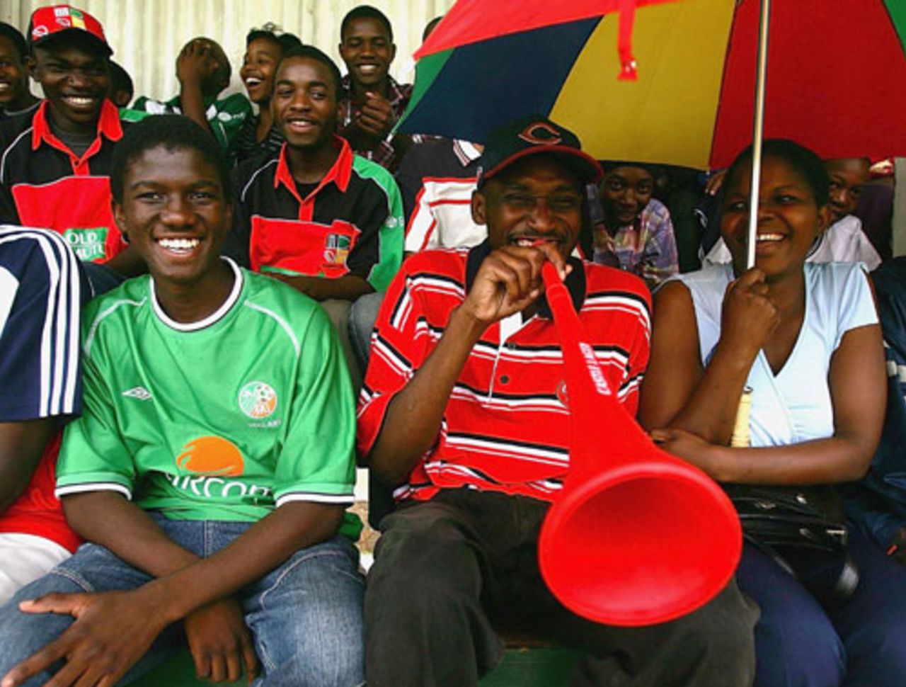 The fans' spirits aren't dampened by a brief downpour, Zimbabwe v England, 3rd ODI, December 2004