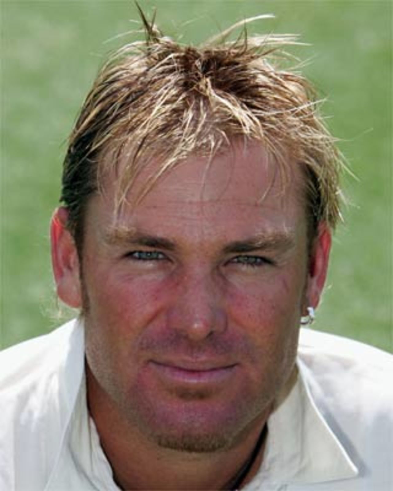 Shane Warne of Australia poses for a head shot portrait before training at the 'Gabba on November 16, 2004 in Brisbane, Australia.