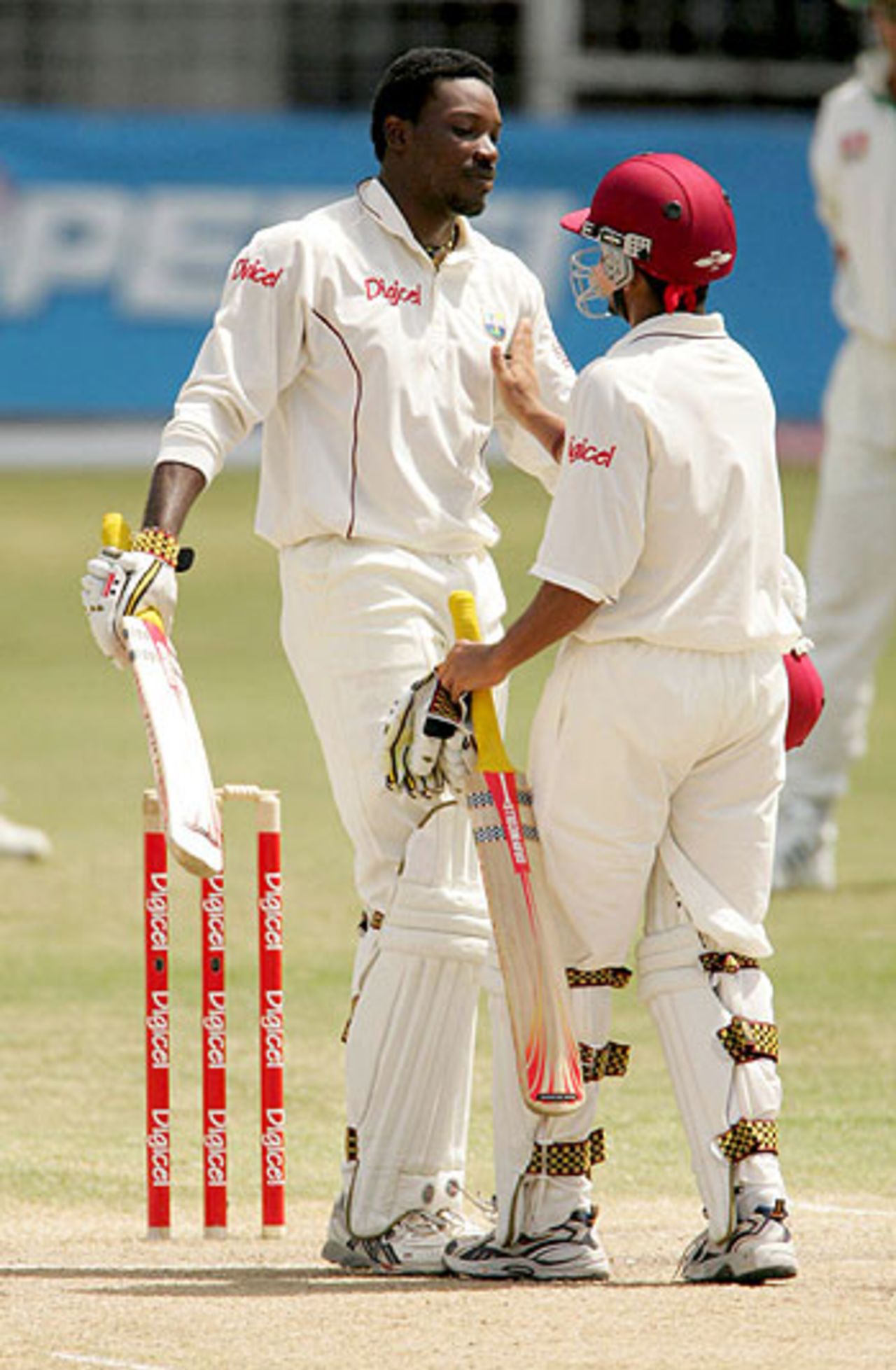 Chris Gayle is congratulated by Ramnaresh Sarwan, as he builds towards a career-best 317, West Indies v South Africa, 4th Test, Antigua, May 2, 2005