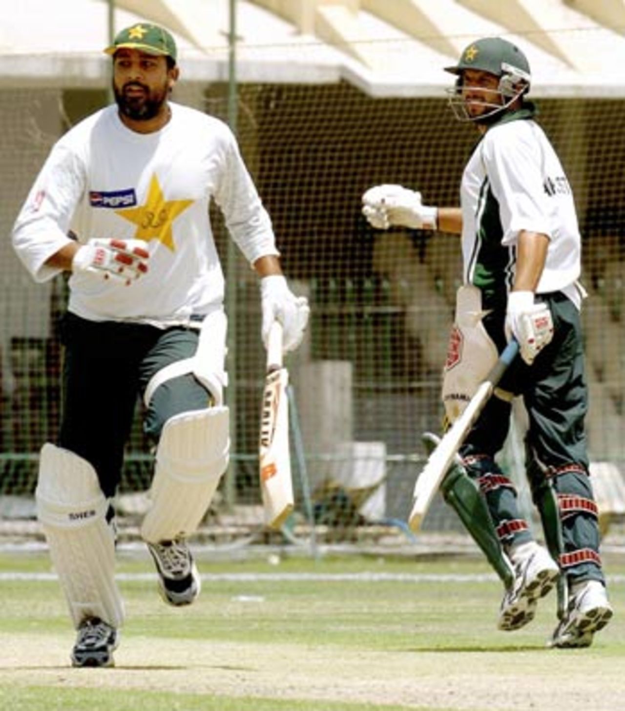 Inzamam-ul-Haq and Shafid Afridi running between the wickets during a training session in Lahore, May 10, 2005