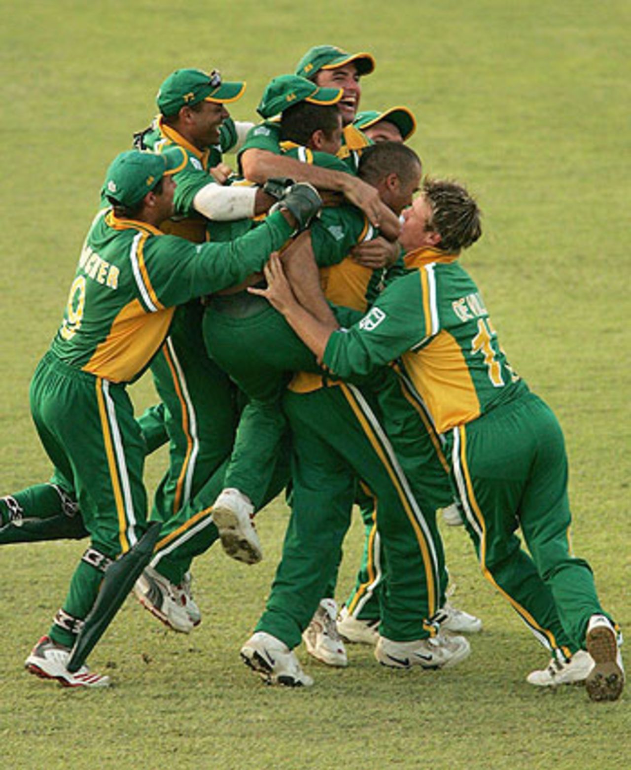 Charl Langeveldt is mobbed by his team-mates after sealing the third one-day international with a final-over hat-trick, West Indies v South Africa, May 11