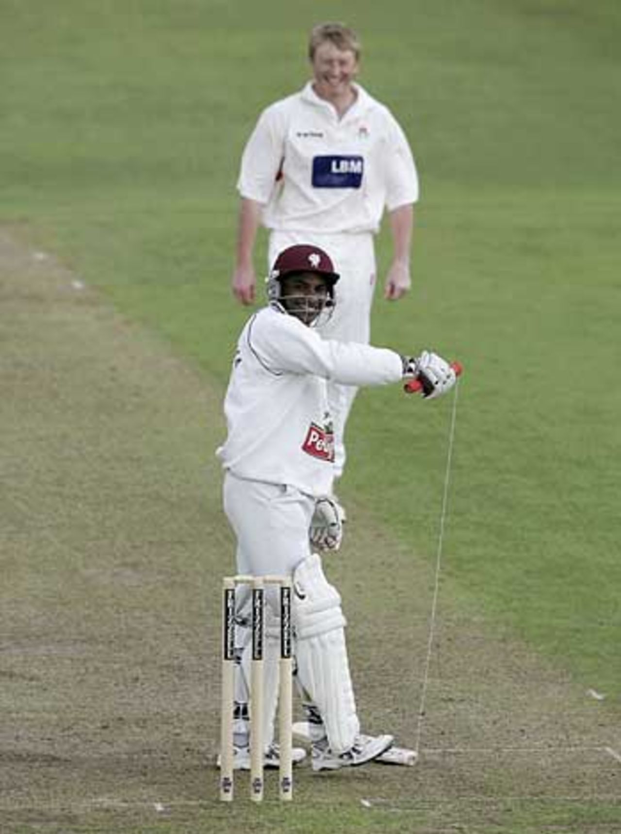 Sanath Jayasuriya shows off his broken bat as Glen Chapple looks on, Somerset v Lancashire, County Championship, Taunton, May 20
