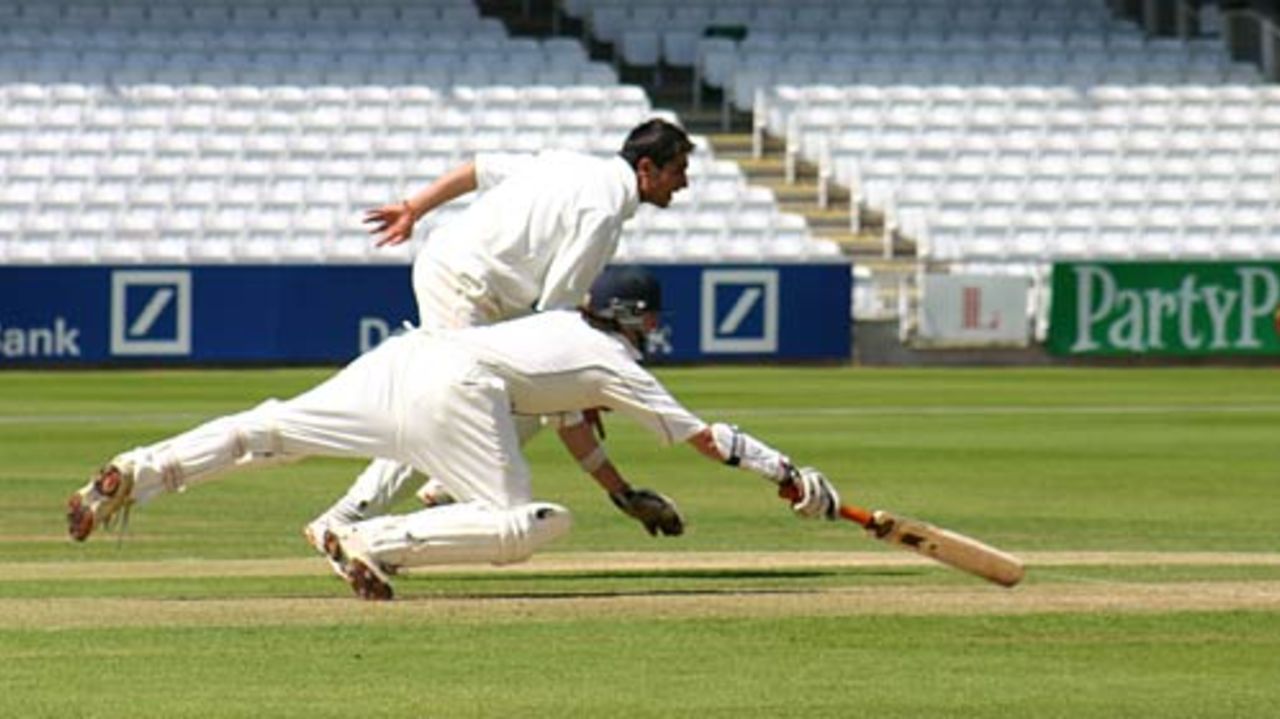 Eton's Redmayne dives for the crease, just beating Habib's shy at the stumps, Eton v Harrow, June 18, 2005