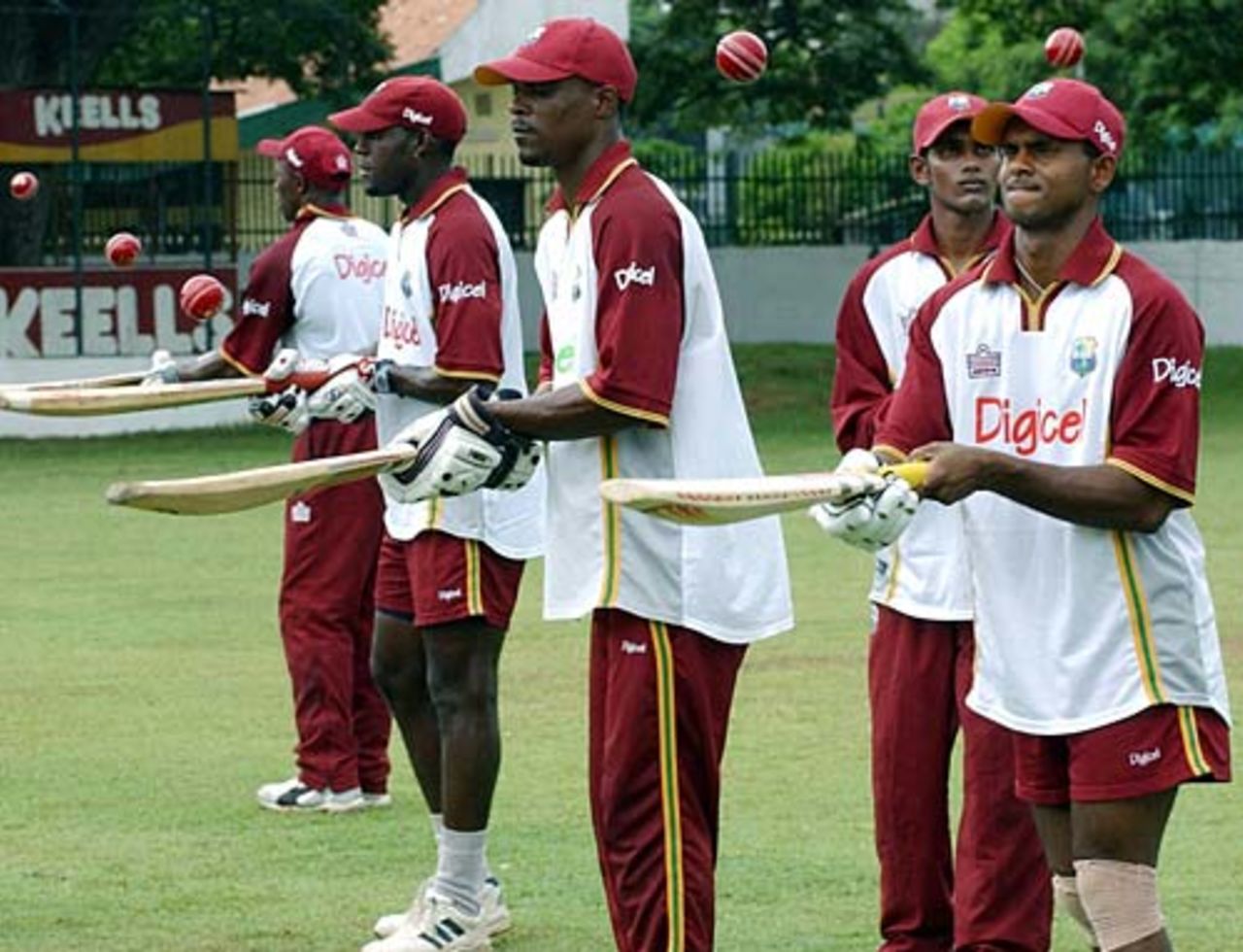 Shivnarine Chanderpaul leads hisWest Indies team in a practice session, Colombo, July 4, 2005
