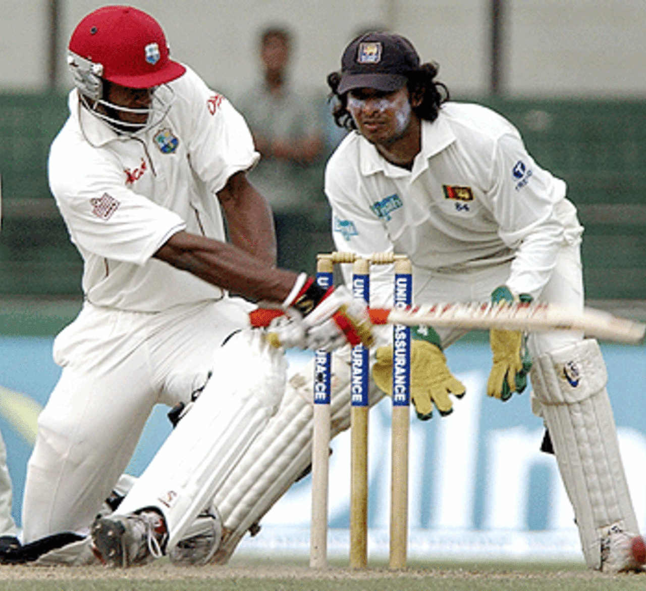 Omari Banks sweeps a ball past Kumar Sangakkara, Sri Lanka v West Indies, 1st Test, SSC, July 13, 2005