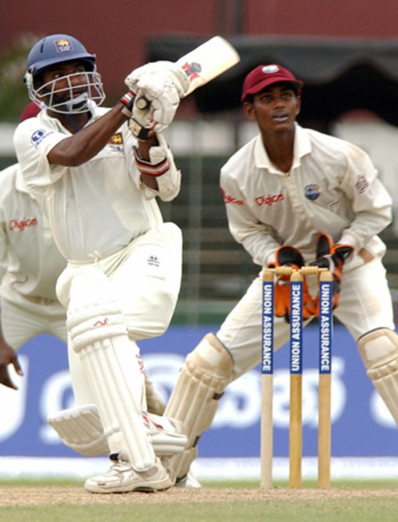 Muttiah Muralitharan scoops a ball to the on side, Sri Lanka v West Indies, Colombo, July 14, 2005