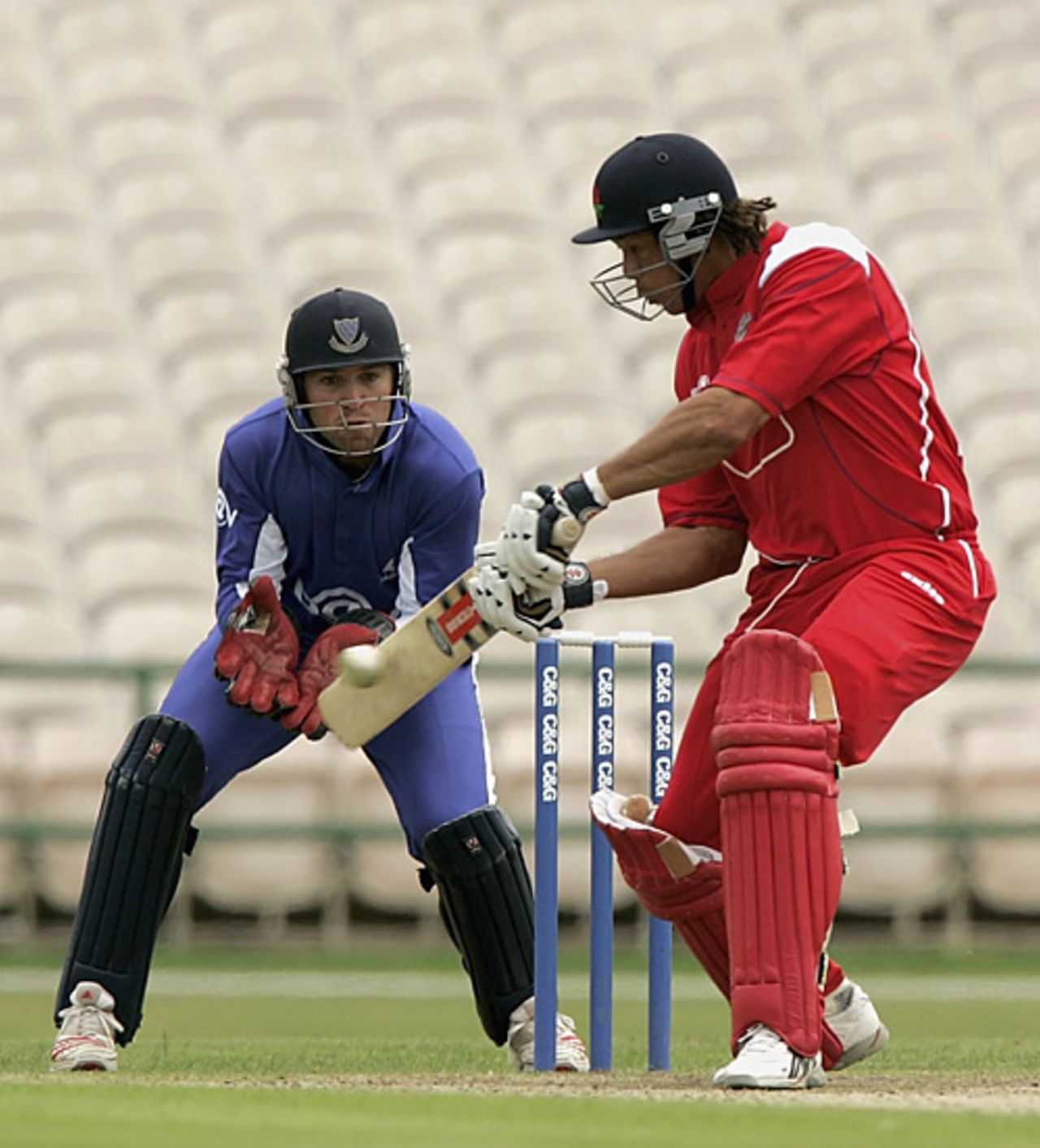 Andrew Symonds on his way his hundred, watched by Matt Prior, C&G quarter finals, Lancashire v Sussex, Old Trafford, July 15, 2005