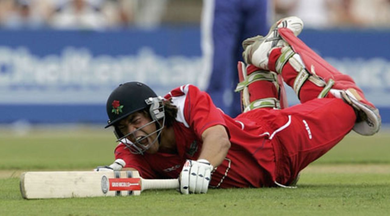 Andrew Symonds dives to reach his hundred, on his debut for Lancashire, Lancashire v Sussex, Old Trafford, July 15, 2005