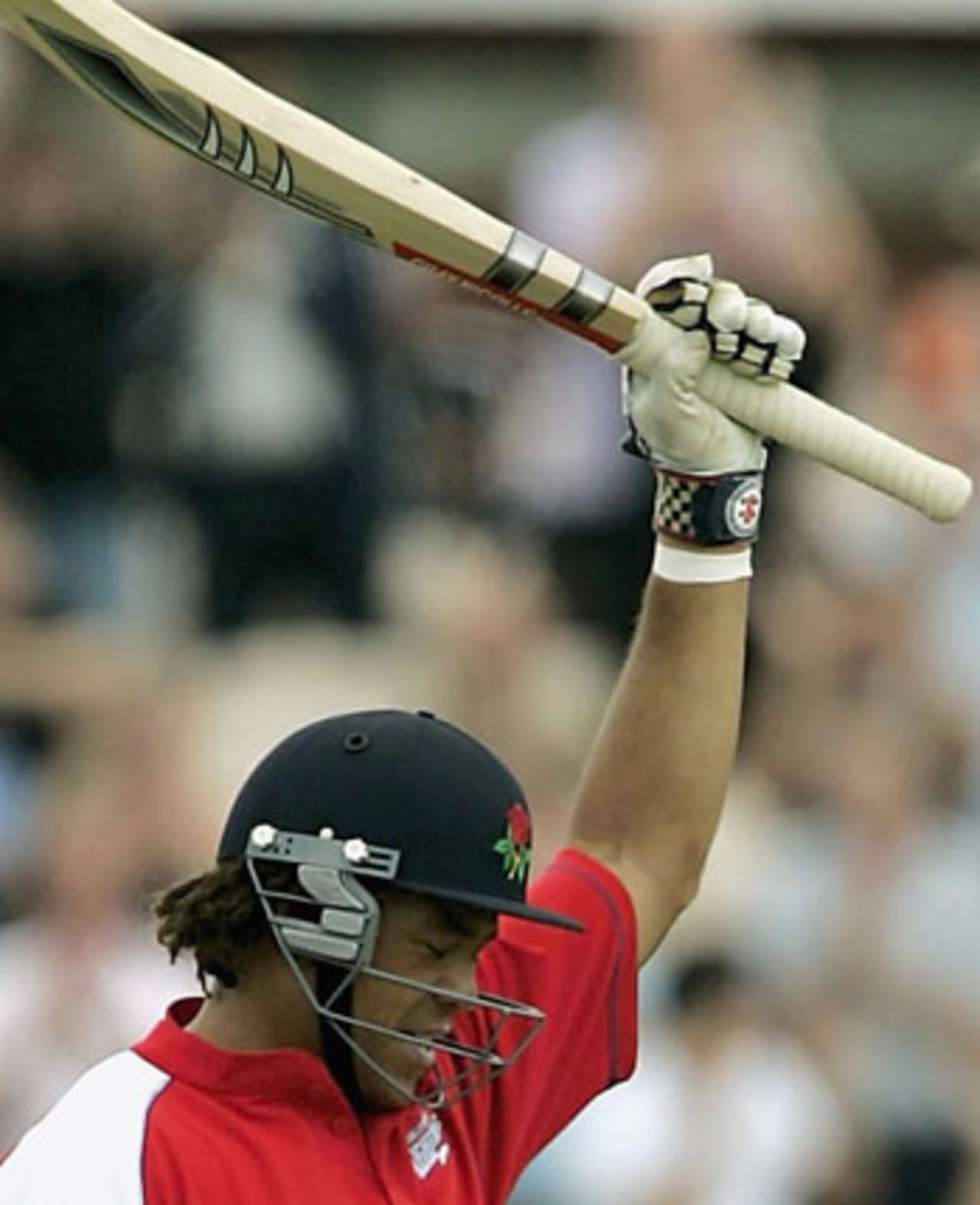 Andrew Symonds raises his bat to celebrate his hundred, on debut for Lancashire, Lancashire v Sussex, Old Trafford, July 15, 2005