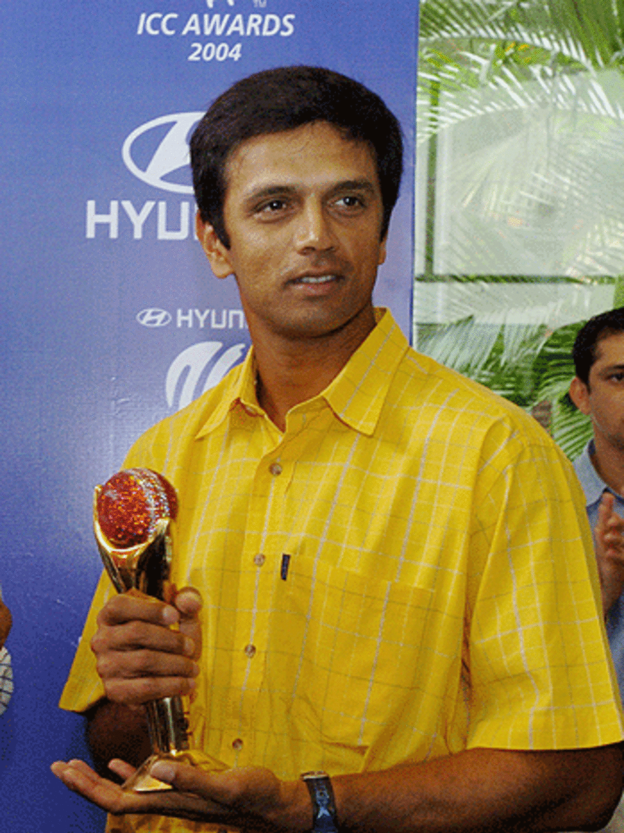 Rahul Dravid holds the trophy for winning the 2004 ICC Player of the Year Award at a function at a motor-car showroom in Bangalore, 20 July 2005
